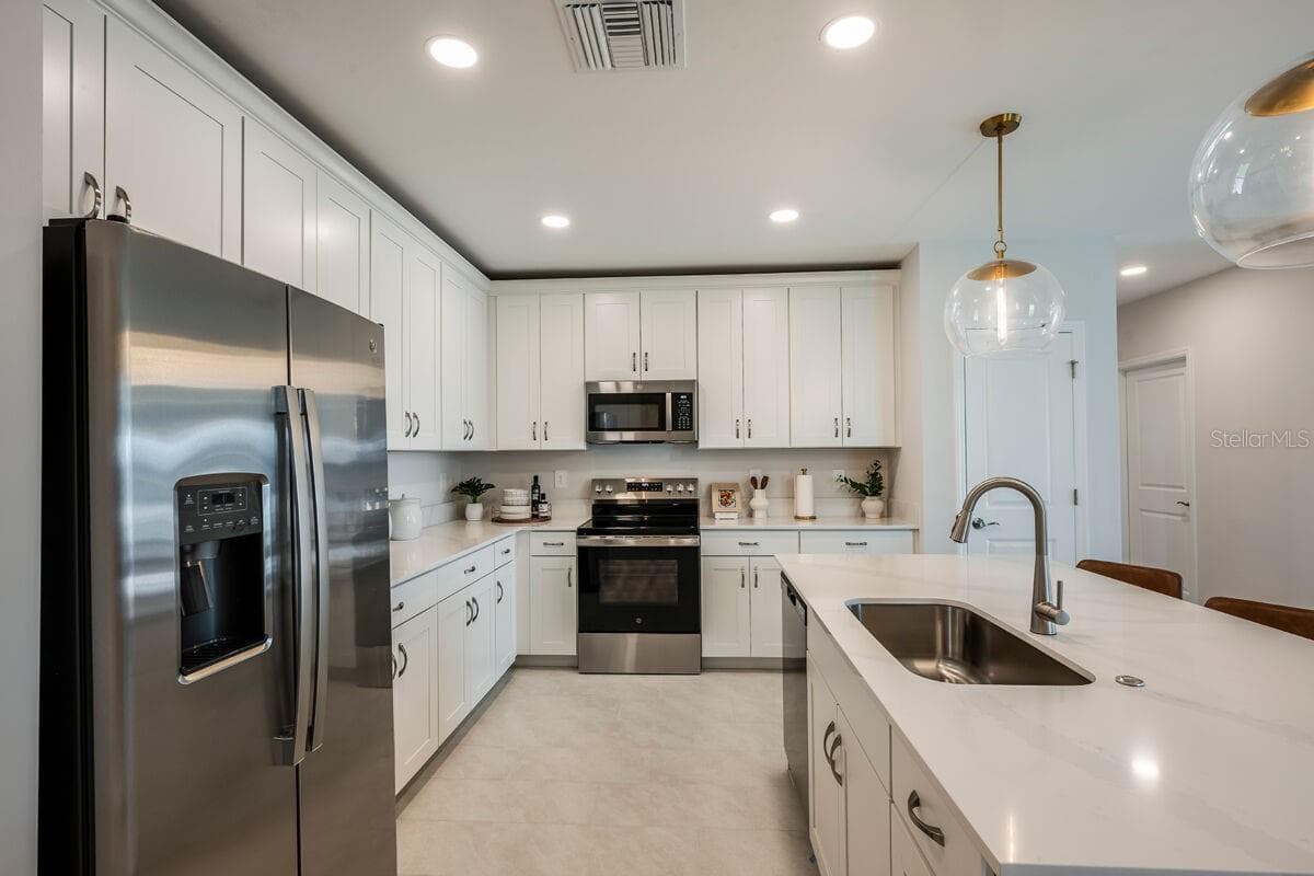 Kitchen-Photo description represents the model home of same floor plan. - 24500 SW KINGSWAY CIR, LAKE SUZY