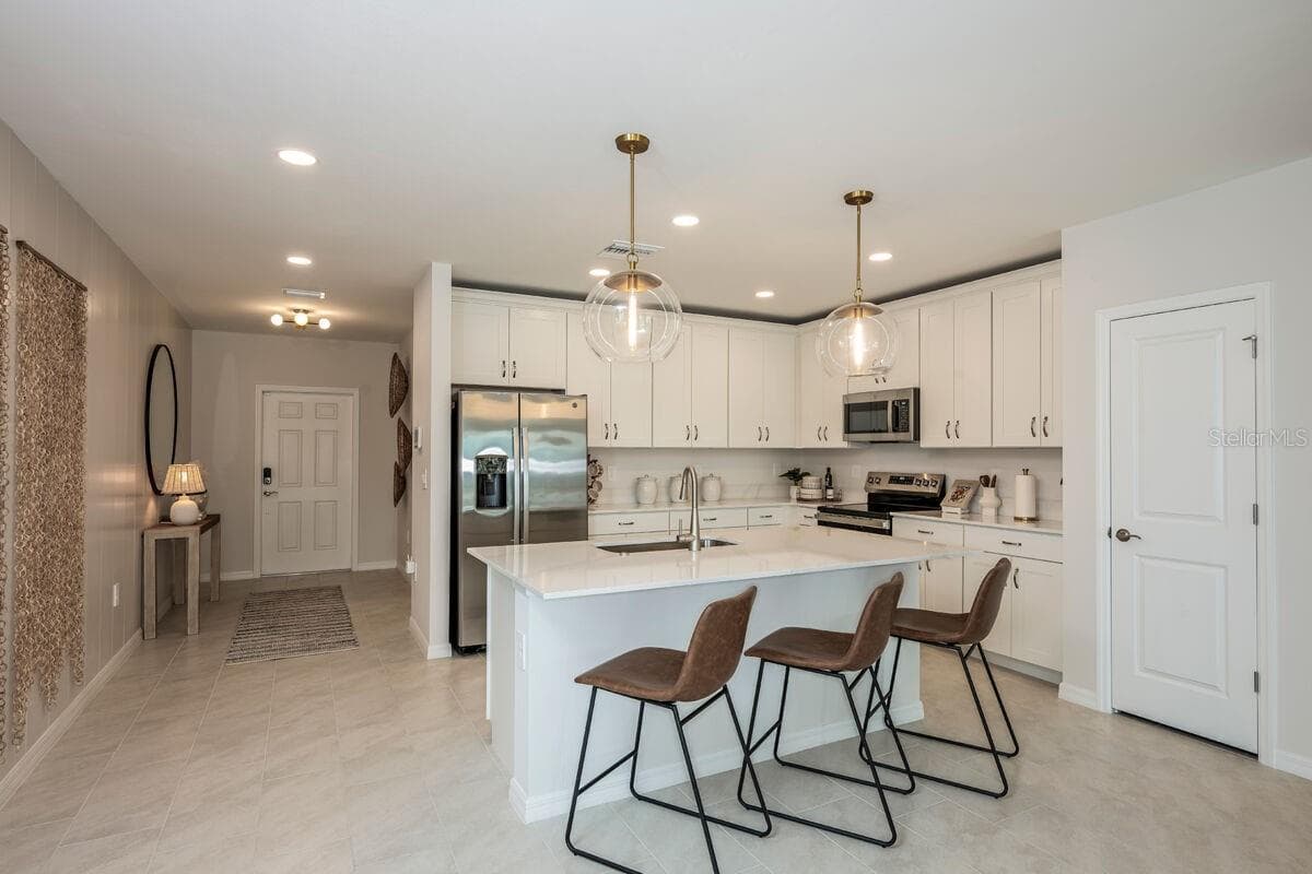 Kitchen-Photo description represents the model home of same floor plan. - 24500 SW KINGSWAY CIR, LAKE SUZY