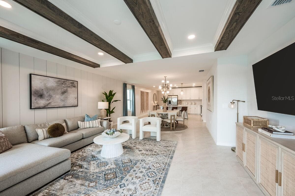 Great Room-Photo description represents the model home of same floor plan. - 24500 SW KINGSWAY CIR, LAKE SUZY