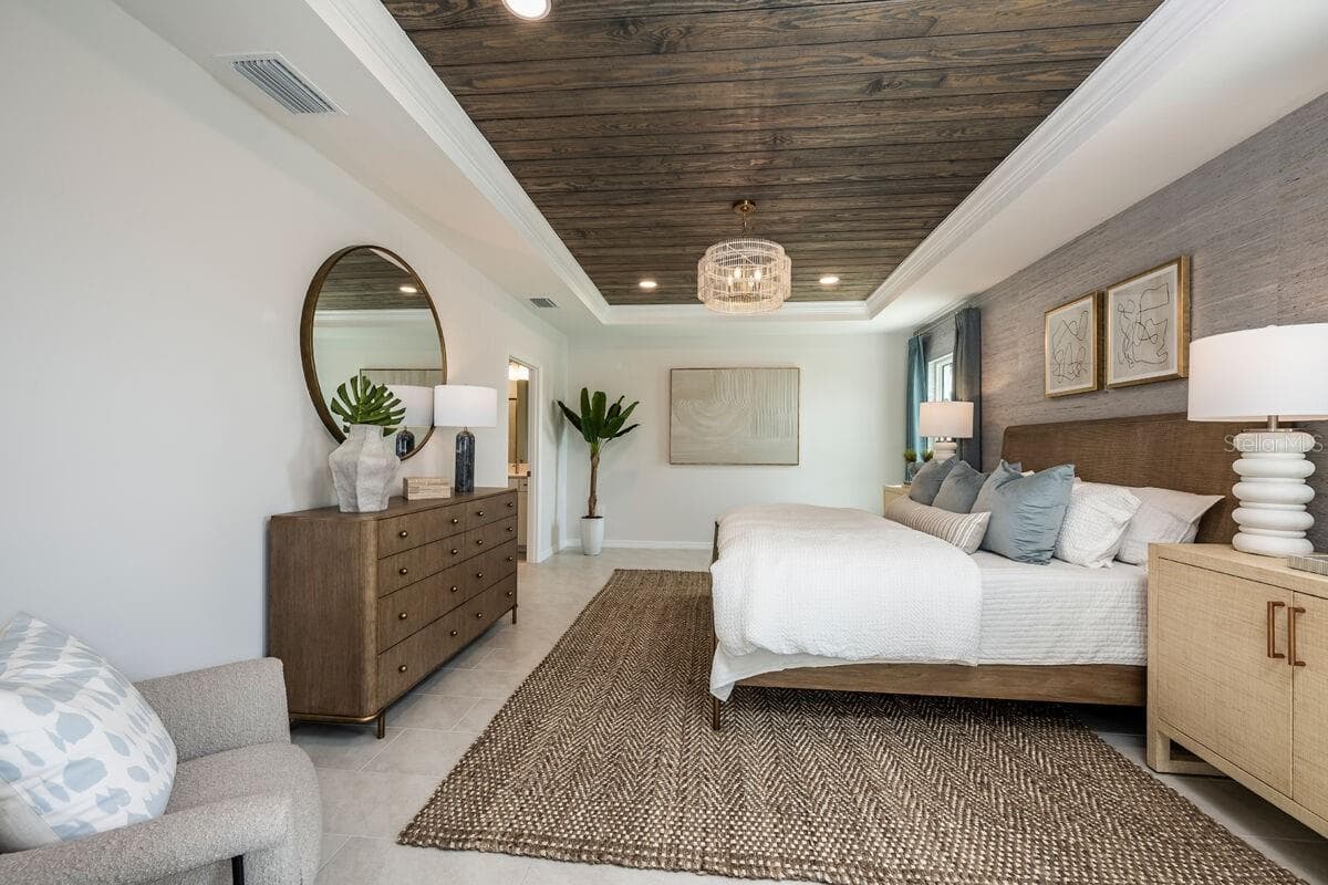 Owners Bedroom-Photo description represents the model home of same floor plan. - 24500 SW KINGSWAY CIR, LAKE SUZY
