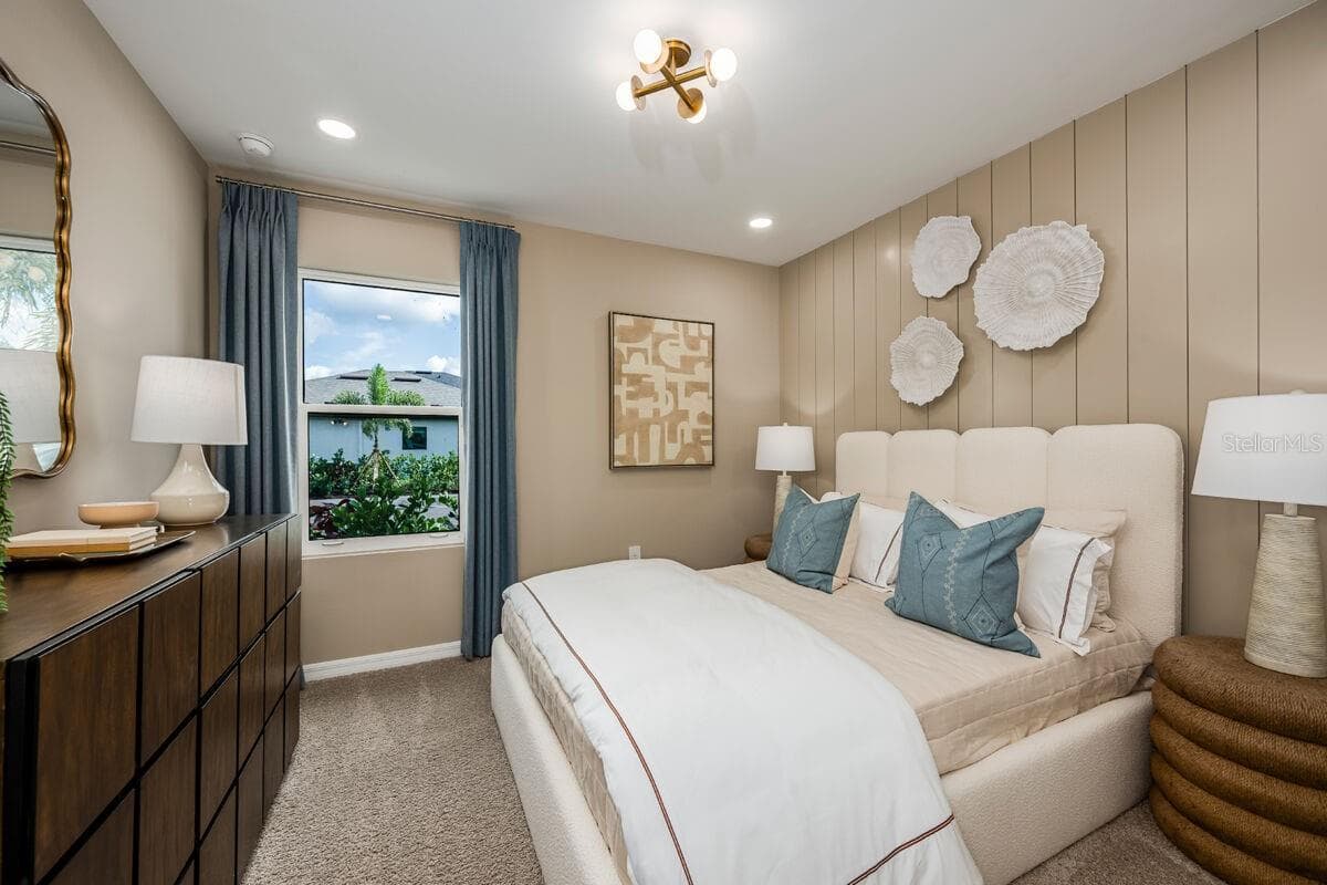 Bedroom 2-Photo description represents the model home of same floor plan. - 24500 SW KINGSWAY CIR, LAKE SUZY