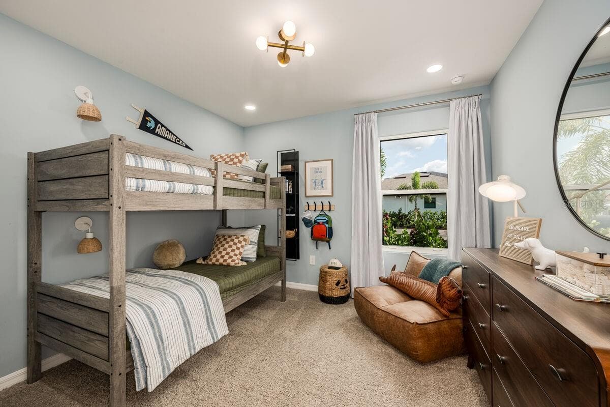Bedroom 2-Photo description represents the model home of same floor plan. - 24500 SW KINGSWAY CIR, LAKE SUZY
