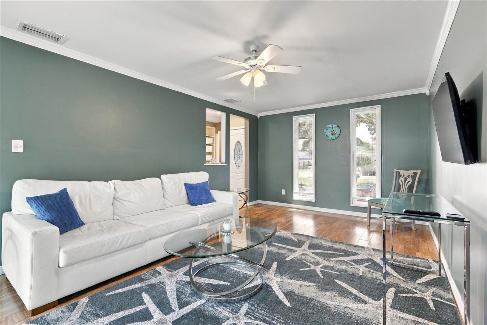 Warm Ambient Lighting Creates a Relaxing and Inviting Living Room Atmosphere - 2629 JAMAICA ST #1, SARASOTA