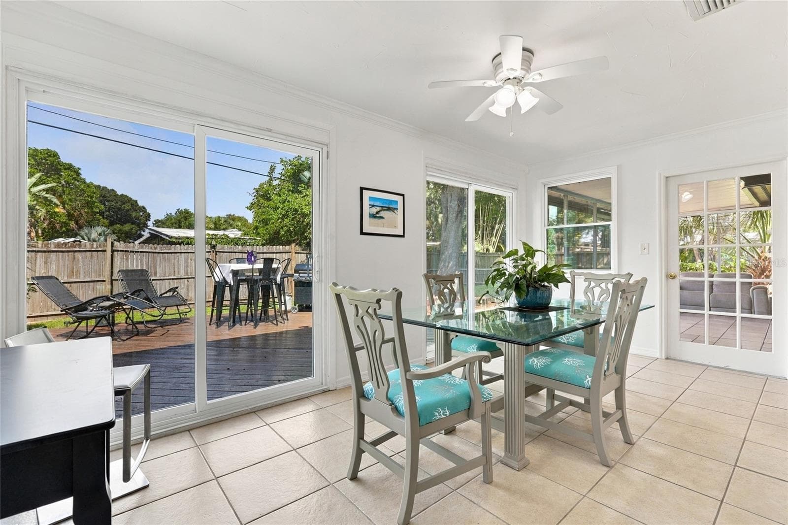 Dining Area Featuring an Updated Sliding Glass Door with Direct Access to the Porch - 2629 JAMAICA ST #1, SARASOTA