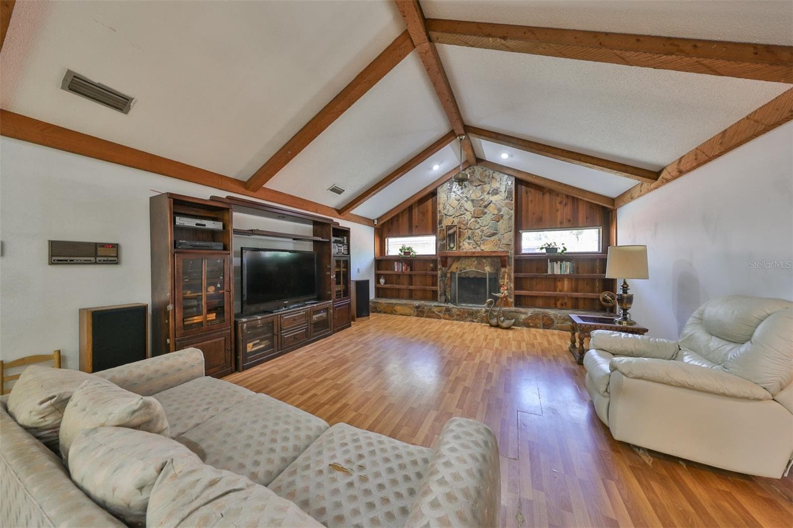 Family room is HUGE with a fireplace, ceiling beams and cathedral ceilings. - 2609 MANOR OAK DR, VALRICO