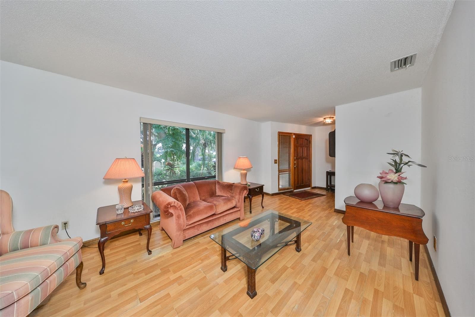 Living Room is large and separate so that you can enjoy solitude or engage in different activities - 2609 MANOR OAK DR, VALRICO