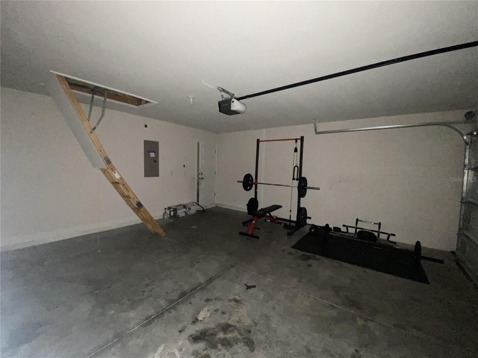 Garage Showing Access Ladder to Attic. - 2091 PECOS DR, POINCIANA