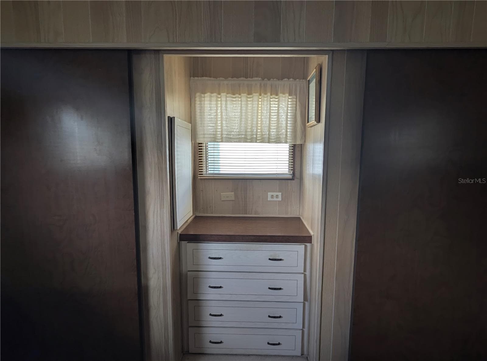 built-in storage and dual closets in master bedroom. - 34517 ROSE DR N, PINELLAS PARK