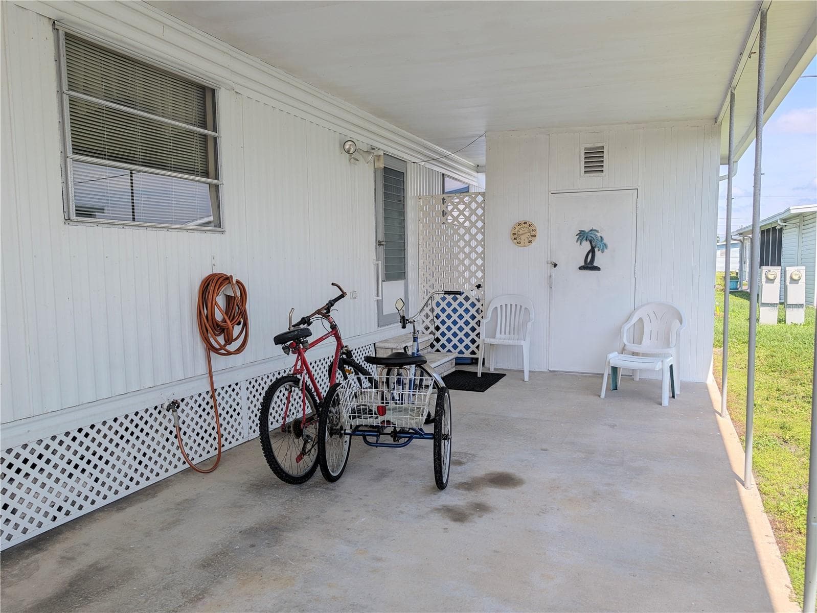 carport and shed. Bikes stay with home. - 34517 ROSE DR N, PINELLAS PARK