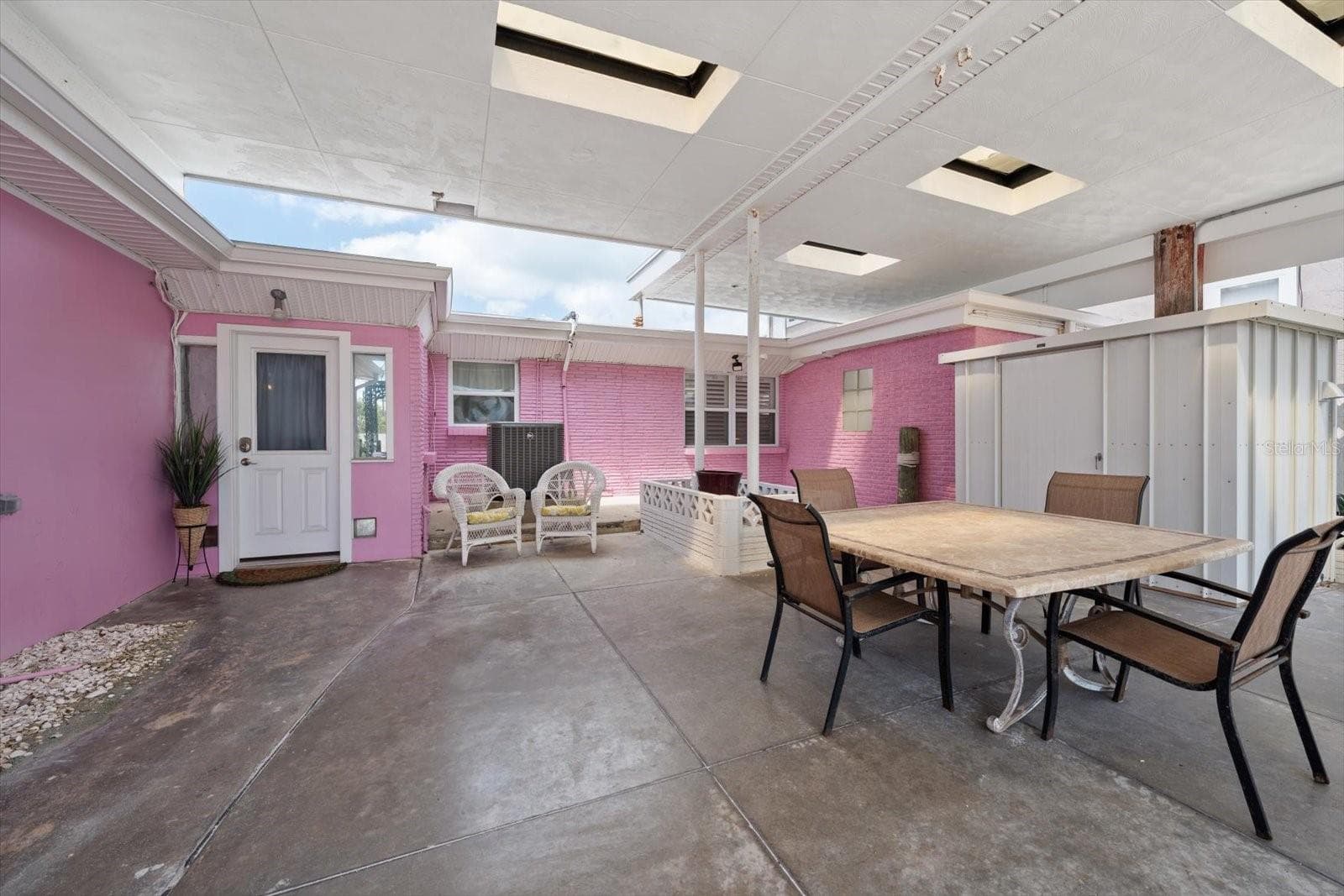Entry area with large covered courtyard to main home - 1512 GULF BLVD, INDIAN ROCKS BEACH