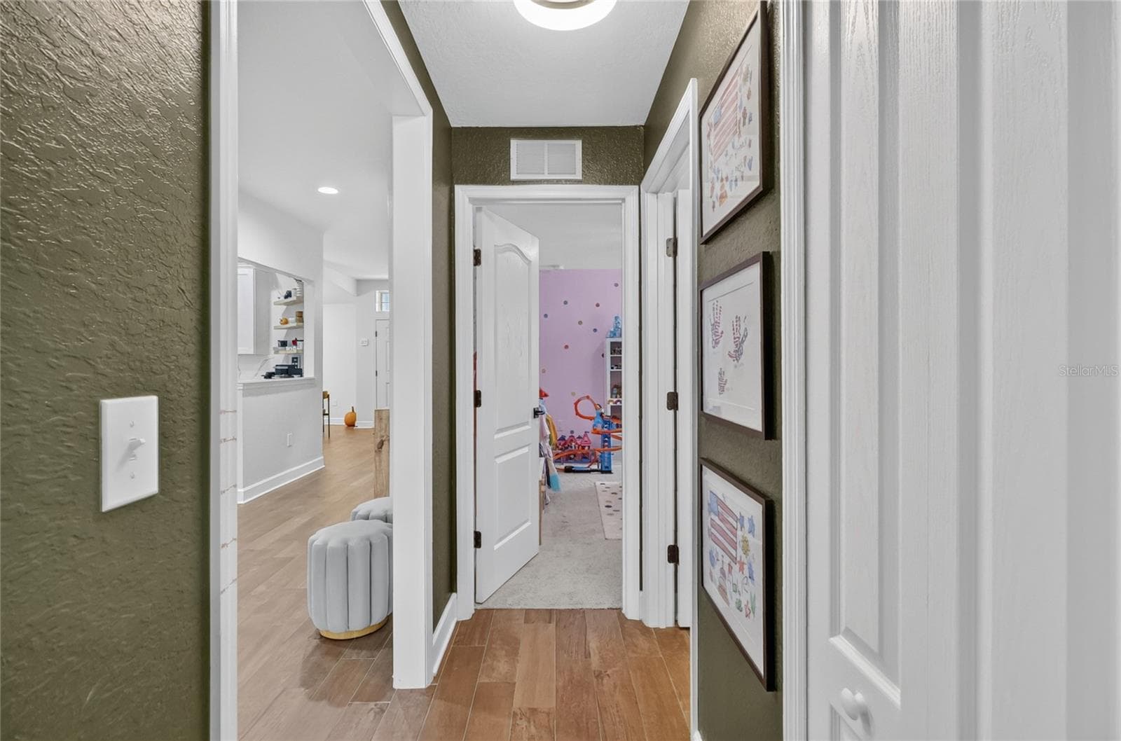 Looking towards the 3rd bedroom which is currently being used as a playroom - 5020 MOSS HAMMOCK TRL, SEBRING