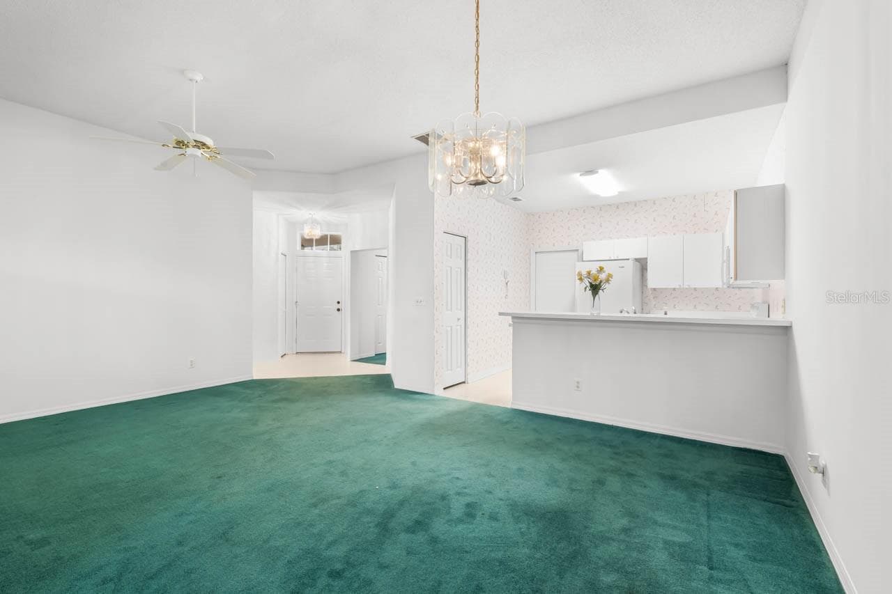Front door entry way, kitchen, and great room - 2617 NEWCOMB CT, SUN CITY CENTER