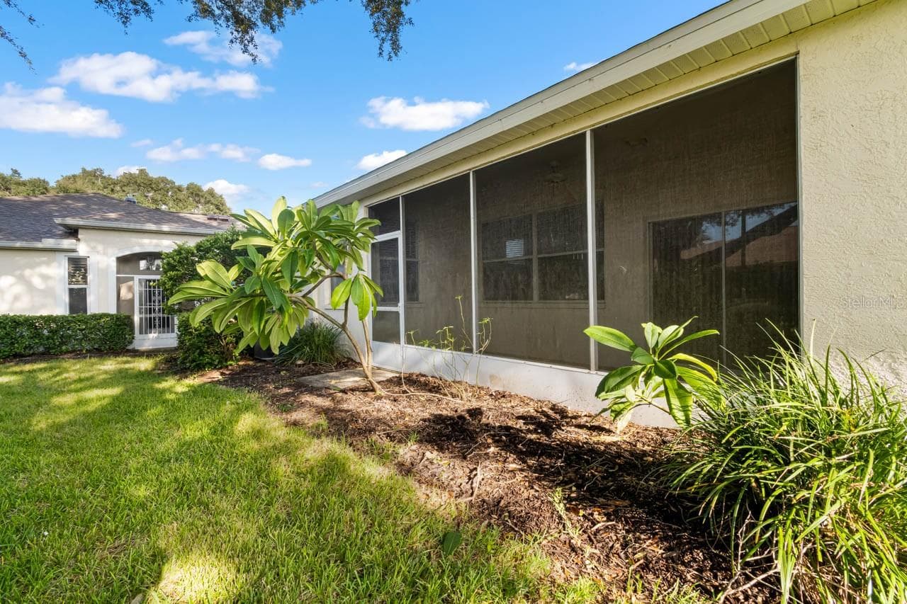 Rear of home facing the screened lanai - 2617 NEWCOMB CT, SUN CITY CENTER