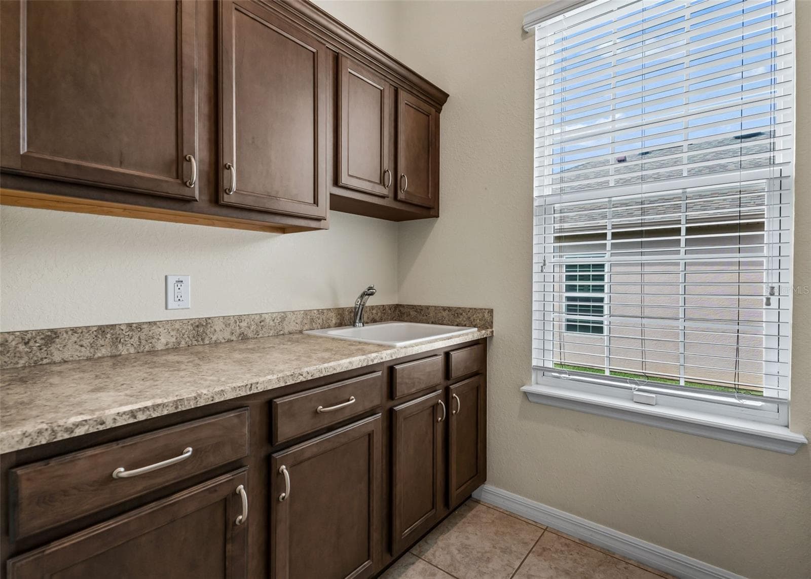 Inside laundry room w/Sink & Extra Cabinets - 11252 SE 170TH PL, SUMMERFIELD