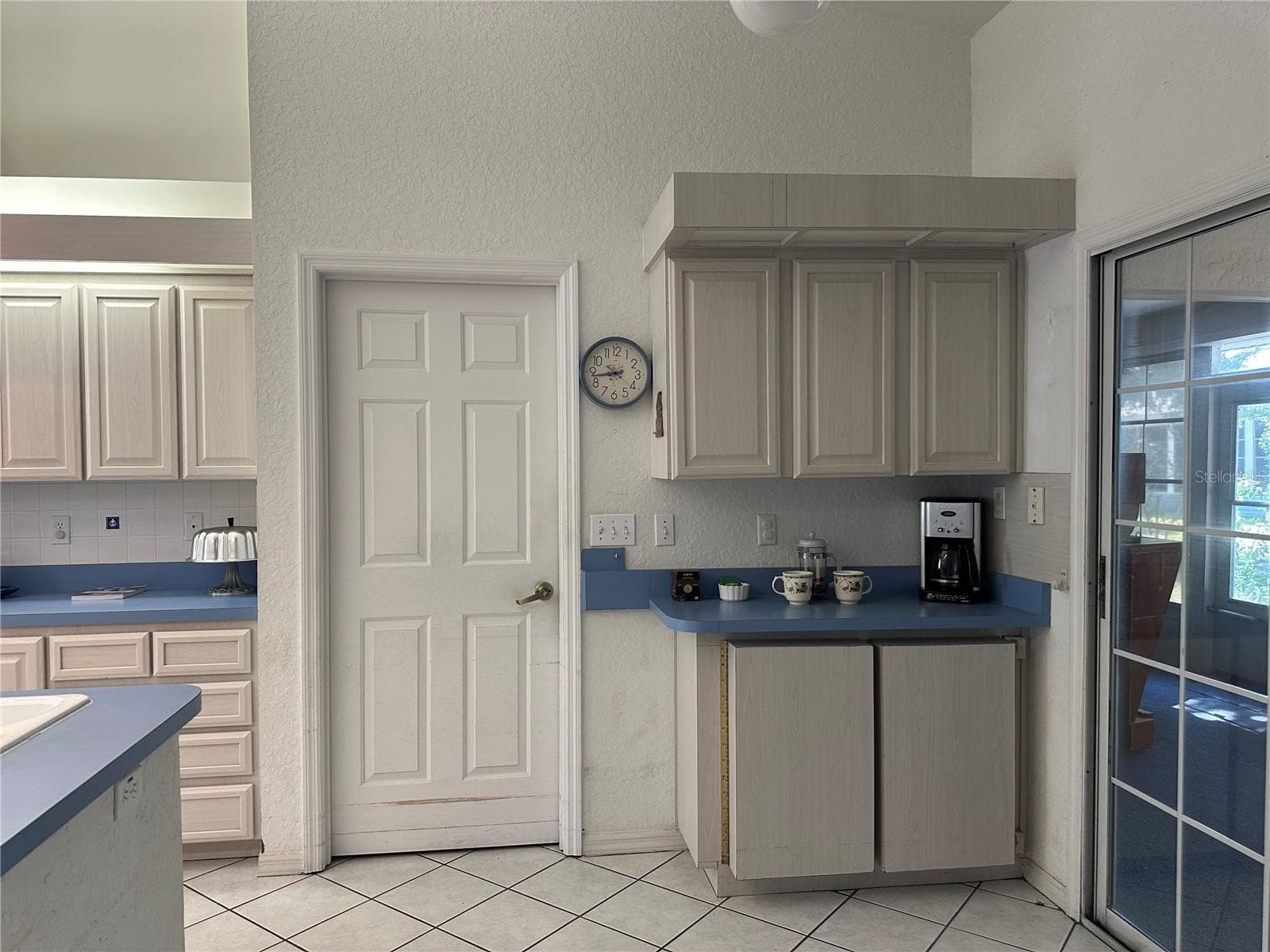 Coffee Bar & Door to indoor laundry room - 10816 SW 83RD AVE, OCALA
