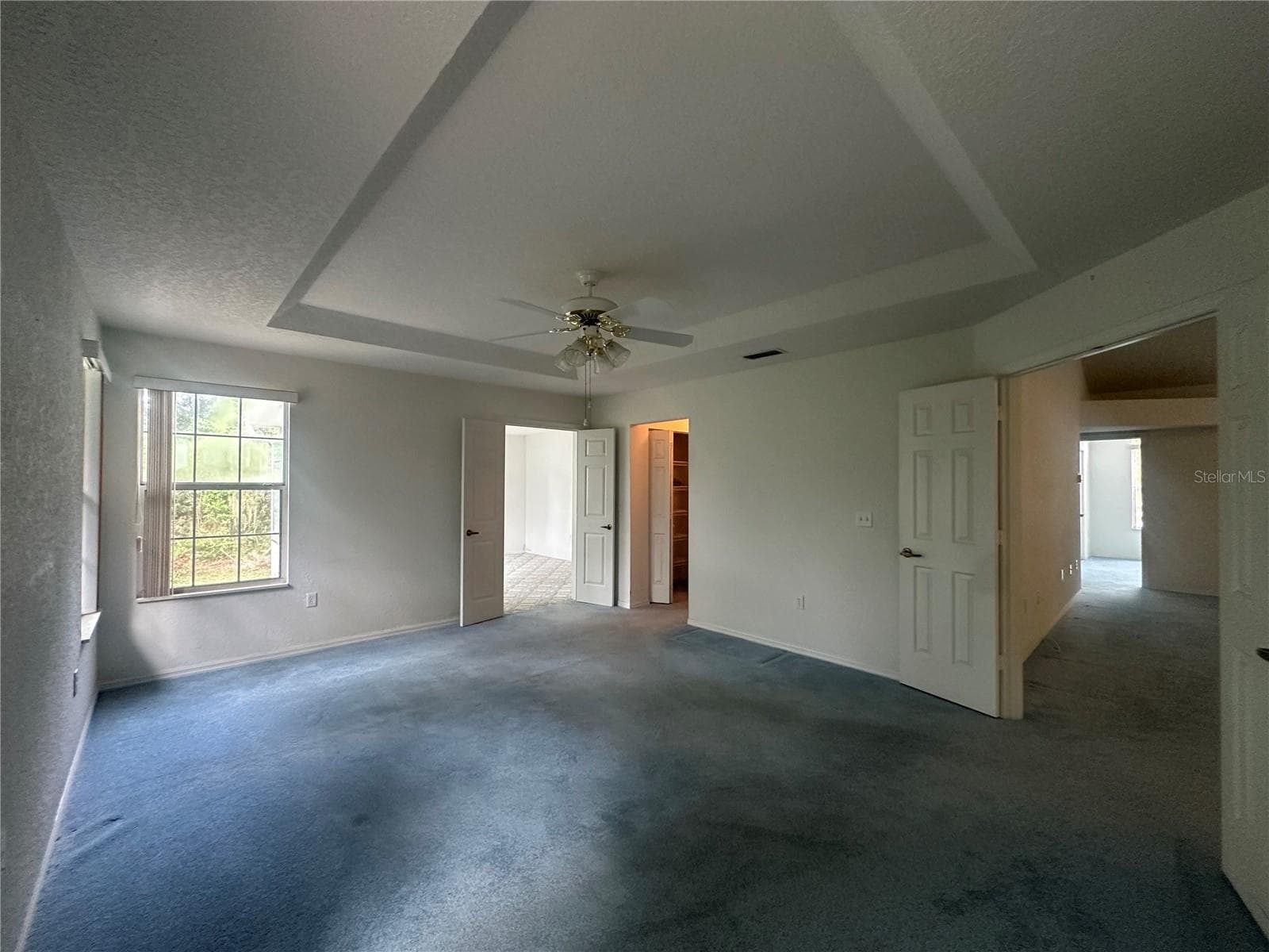 Master Bedroom has tray ceiling & double doors to master bonus room - 10816 SW 83RD AVE, OCALA