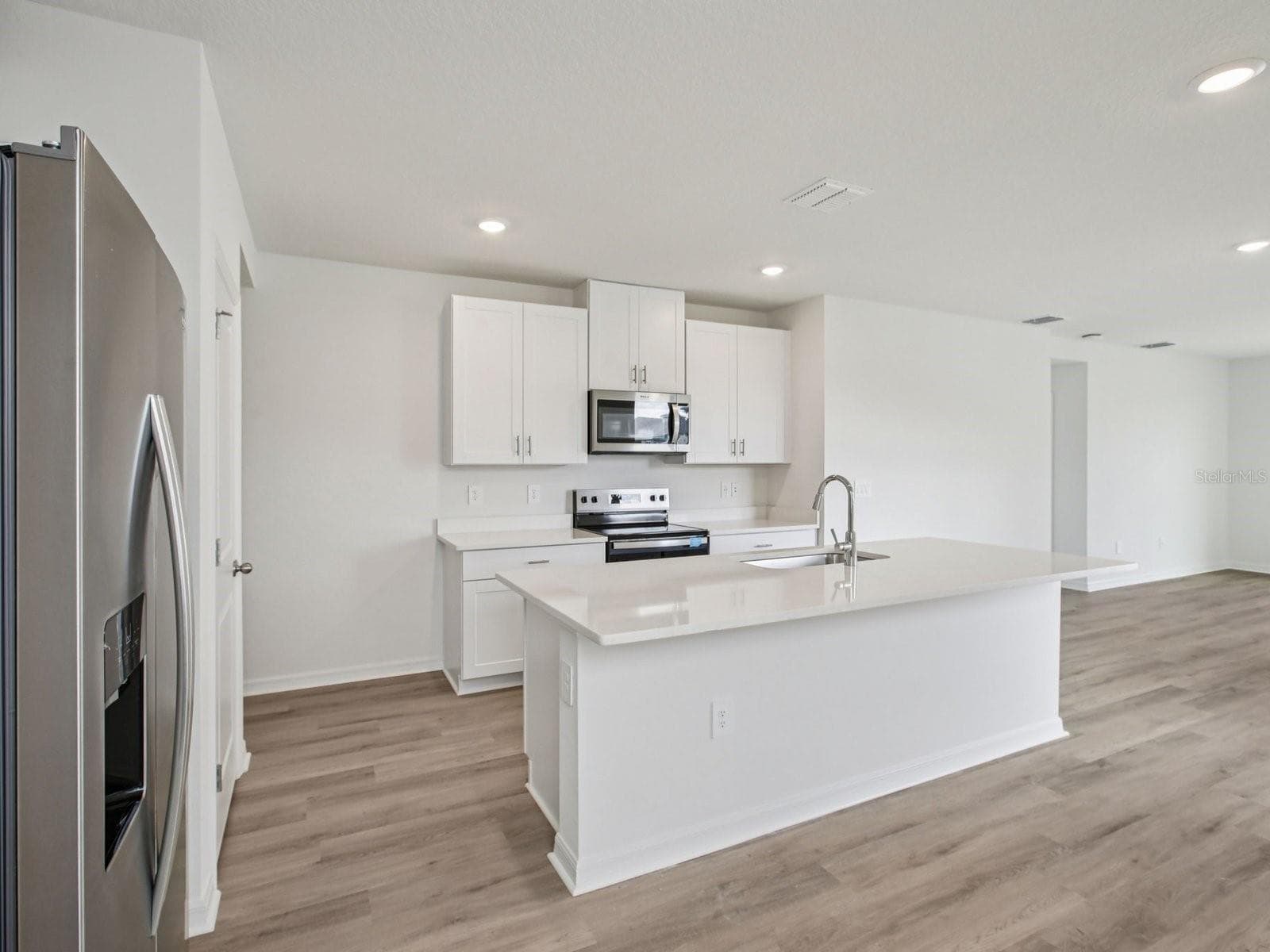 Photo is not of the actual home, but is an inspirational photo of builder’s model home and may depict options, furnishings, and/or decorator features that are not included. - 1532 BREKEY WAY, ZEPHYRHILLS