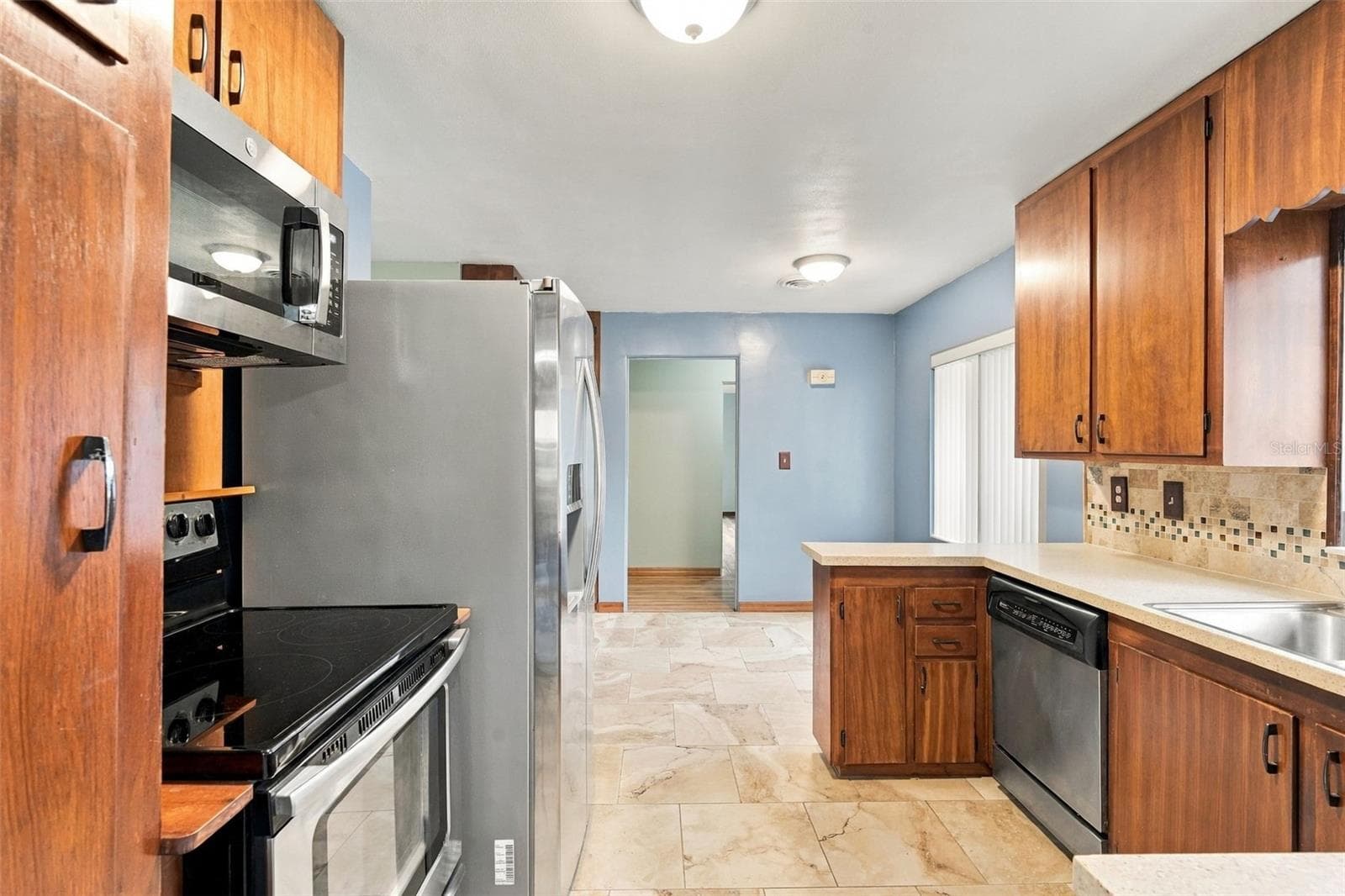 Kitchen From Florida Room, eating space in kitchen - 480 W NEW YORK AVE, ORANGE CITY