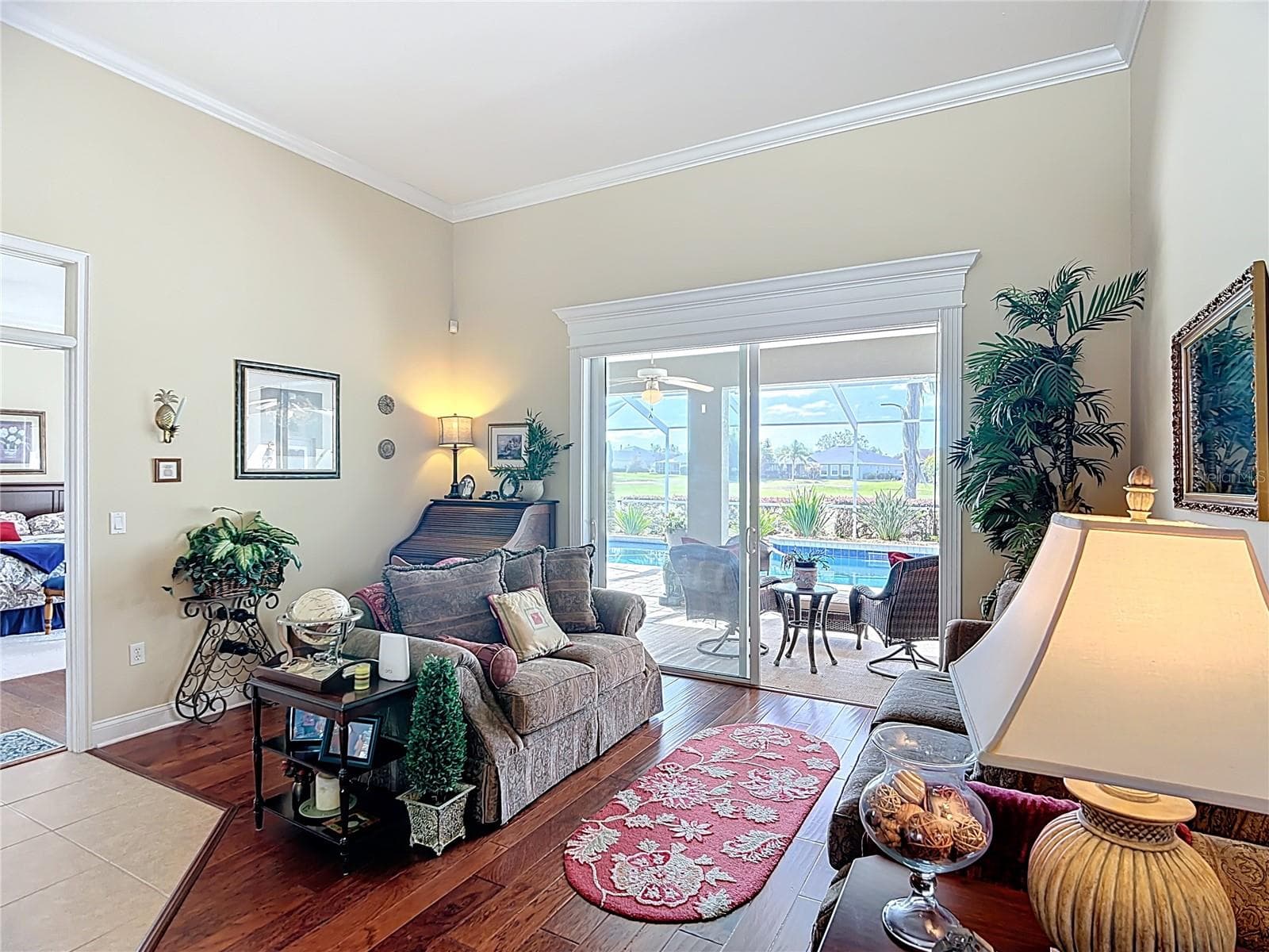 Formal Living room with views of pool and golf course. All pictures with furniture taken while home was sill occupied. - 455 OSPREY LANDING WAY, LAKELAND