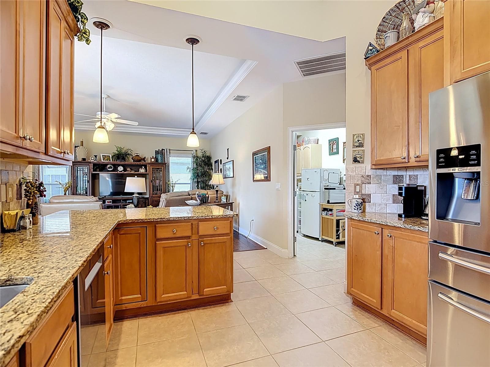 Kitchen view into family room - 455 OSPREY LANDING WAY, LAKELAND
