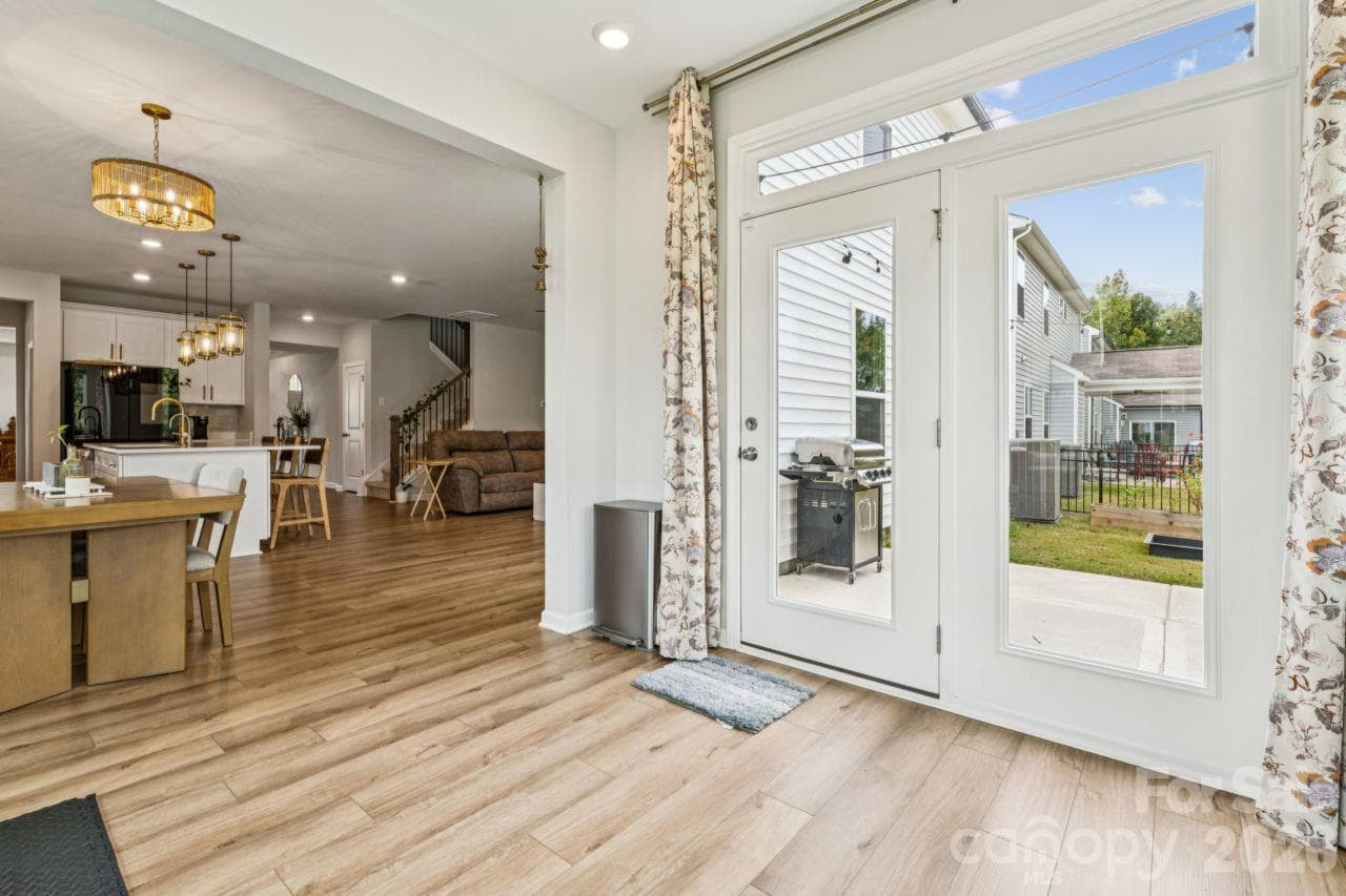 Sunroom with door to back patio - 8704 Frank Grier Road, Charlotte