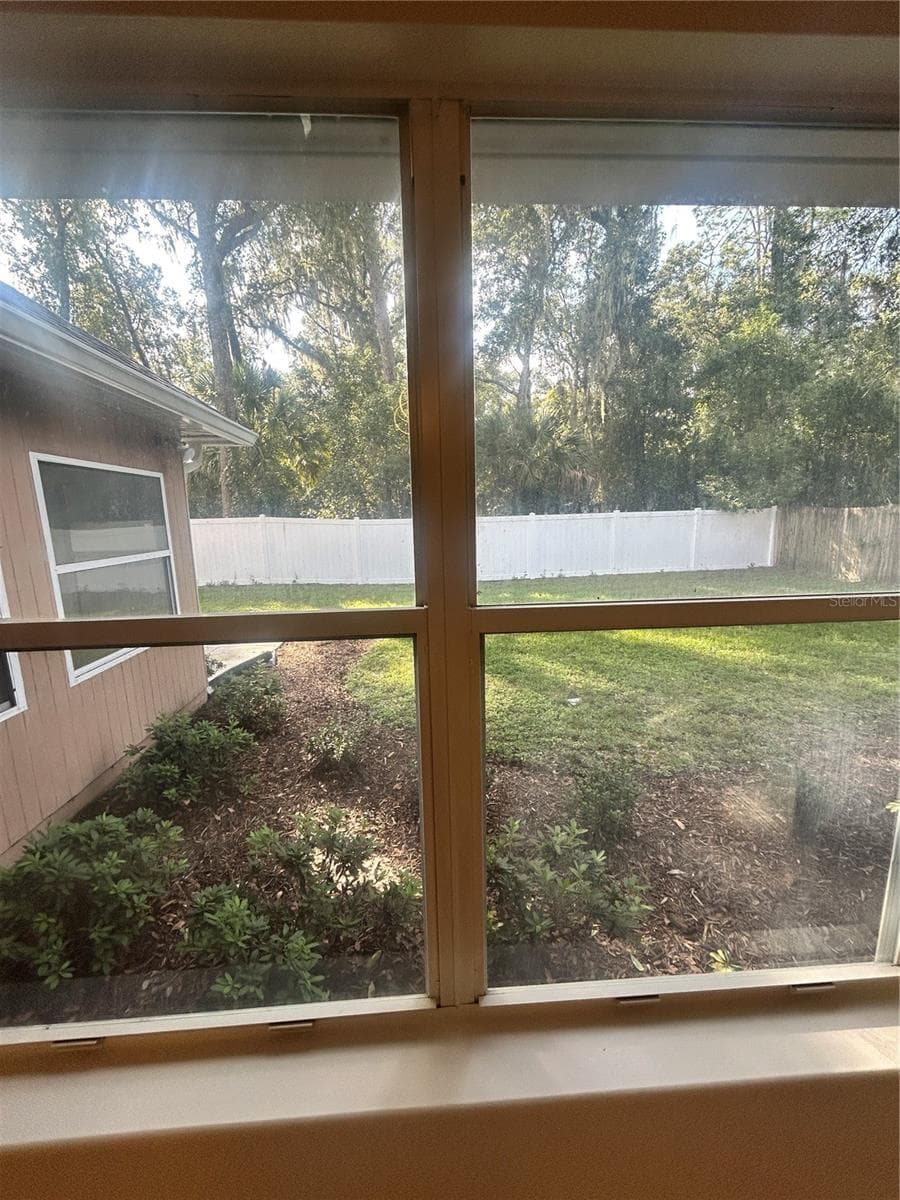 DINING ROOM WINDOW VIEW OF GARDEN - 1901 KNOLTON AVE, ORANGE CITY