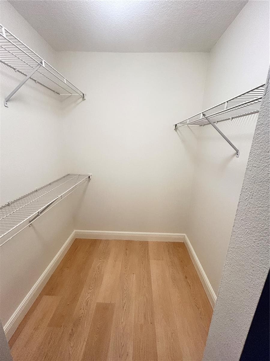 PRIMARY BEDROOM WALK IN CLOSET - 1901 KNOLTON AVE, ORANGE CITY
