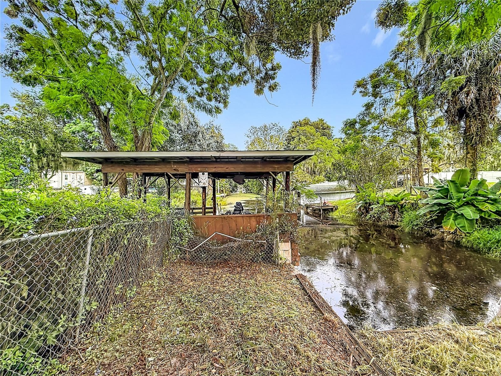 Canal ends in back yard. Chain of Lake Harris access! - 32848 COUNTY ROAD 473, LEESBURG