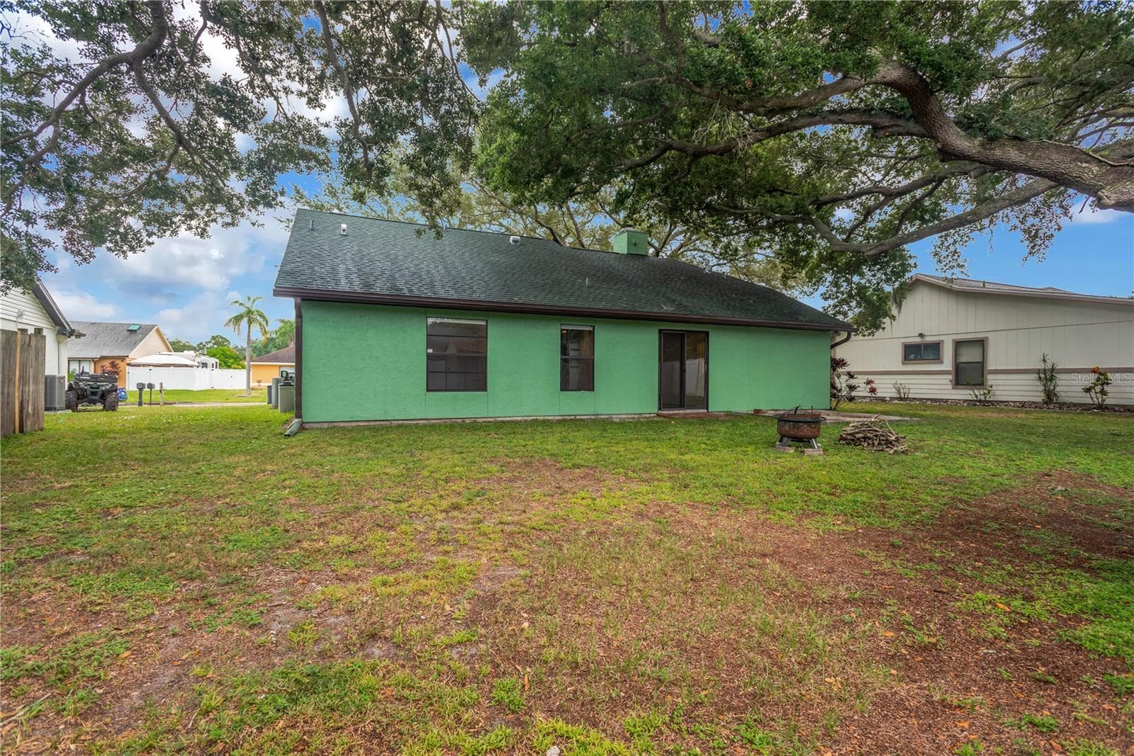 Backyard with firepit and wood, ready for those cool Fall and Winter evenings - 5546 34TH CT E, BRADENTON