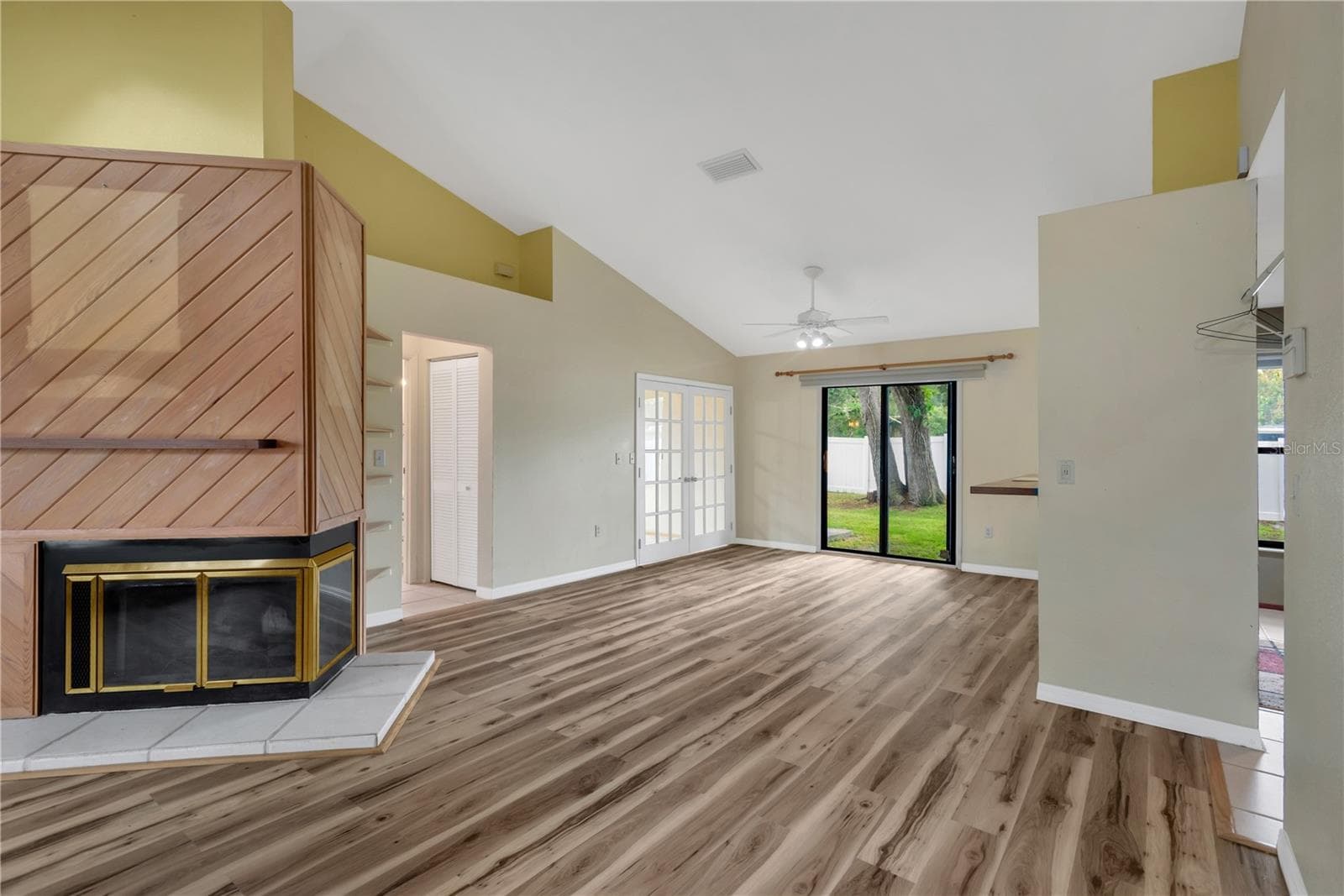 Light and Airy Dining Area with pass-through bar to Kitchen and open to Living Room with Sliding Doors out to backyard. - 5546 34TH CT E, BRADENTON