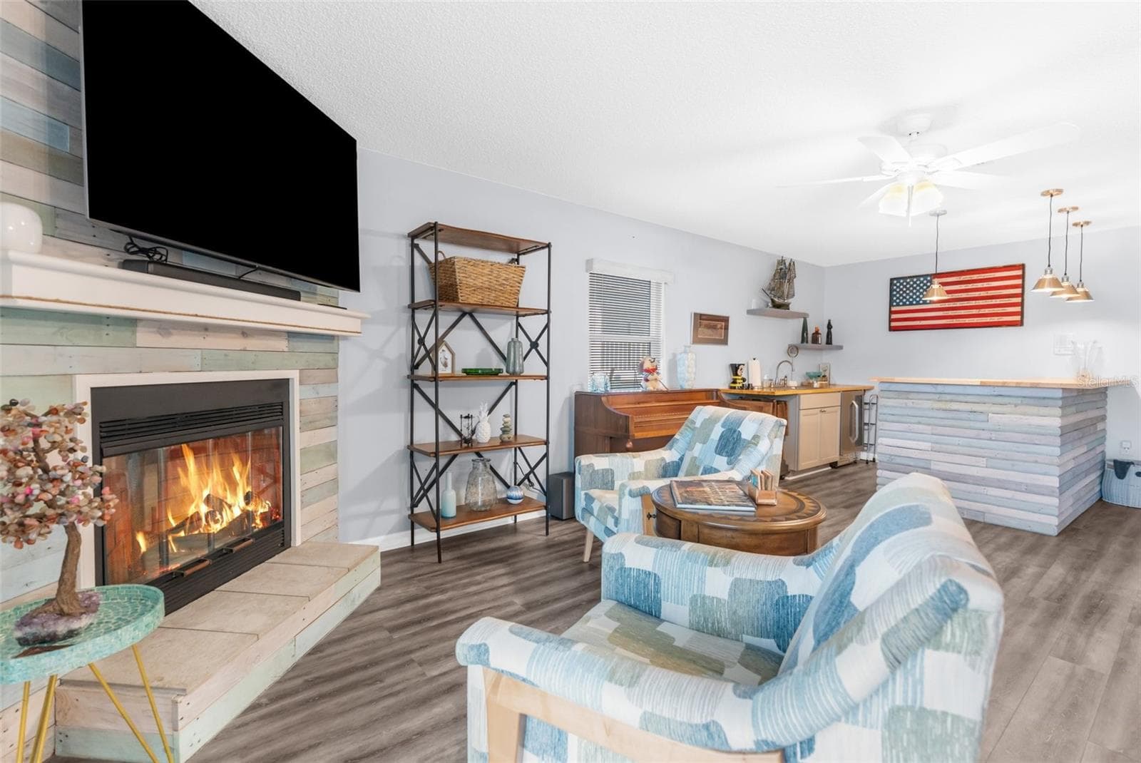 Living Room with Fireplace - Could be in Law Suite with separate entrance attached to home. Located on first floor. - 6029 BAYWAY CT, NEW PORT RICHEY