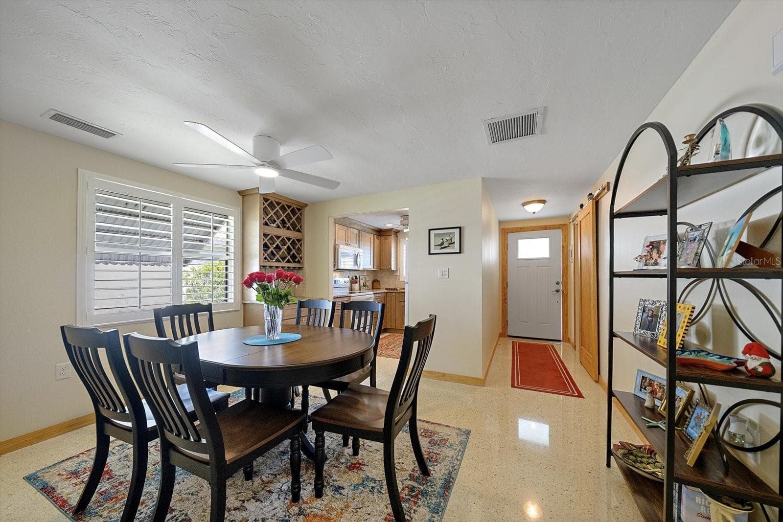 Dining area with wine rack - 738 SPANISH DR S #98, LONGBOAT KEY