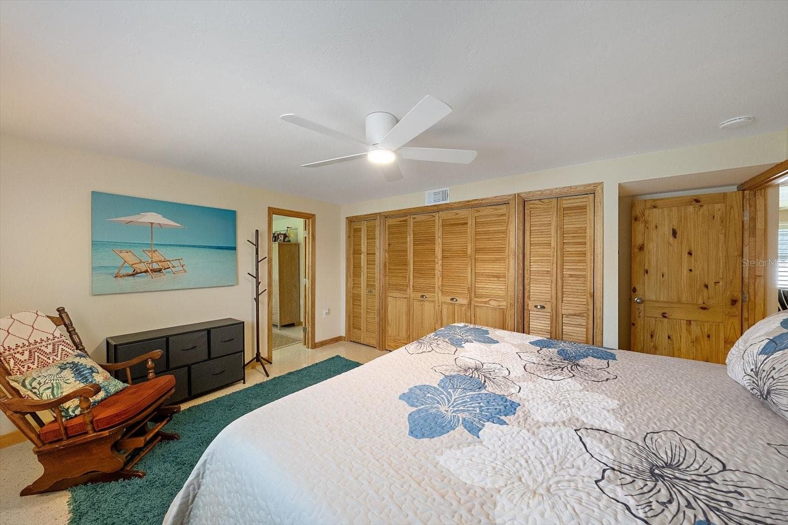 Bedroom with ceiling fan and nautical decor - 738 SPANISH DR S #98, LONGBOAT KEY
