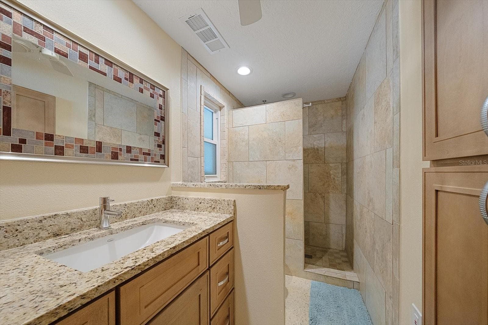 Bathroom vanity with mirror - 738 SPANISH DR S #98, LONGBOAT KEY