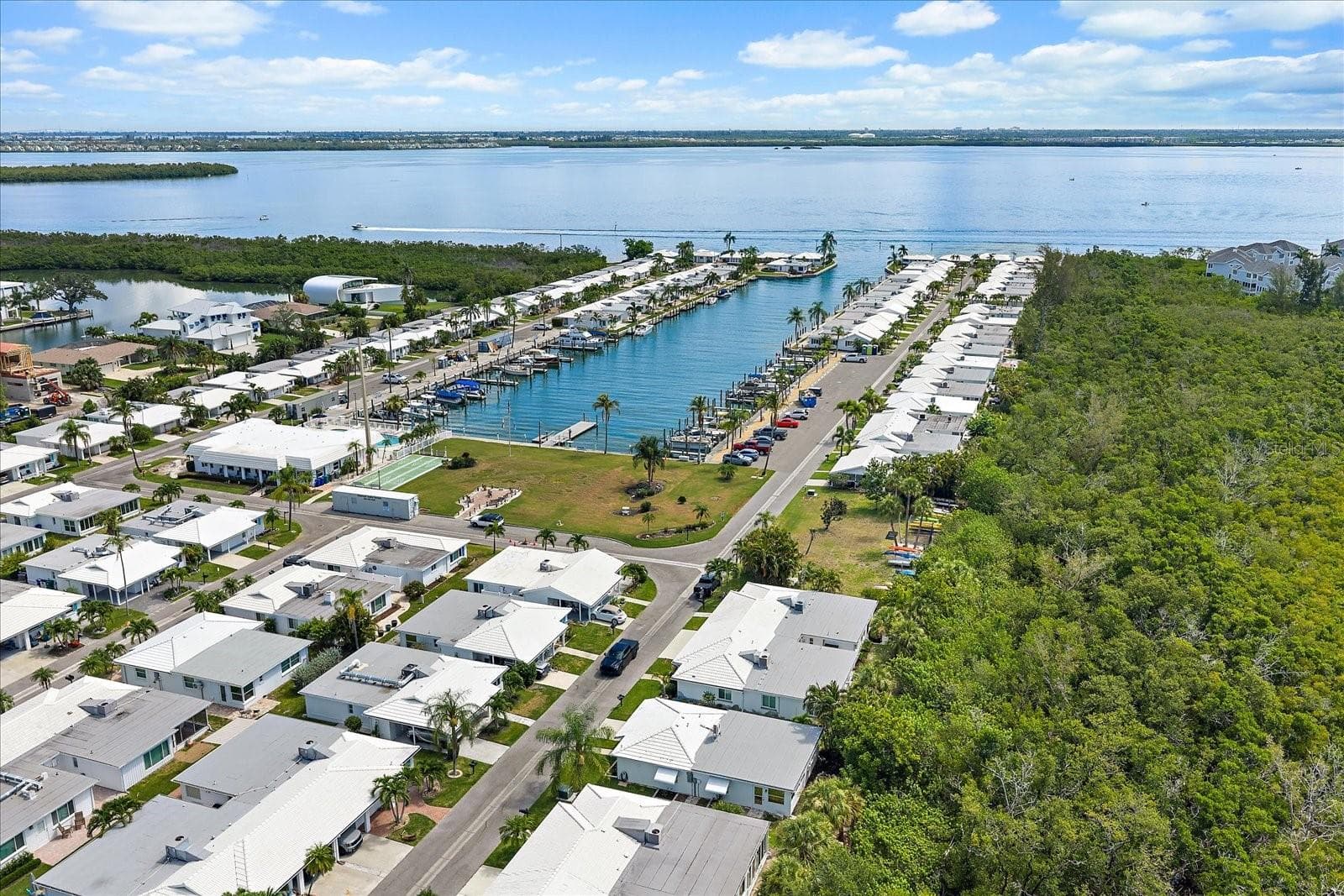 Aerial view of marina canal adjacent to the community - 738 SPANISH DR S #98, LONGBOAT KEY