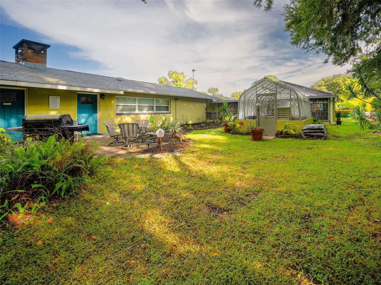 Back Yard with Greenhouse - 35546 CALLA CT, LEESBURG