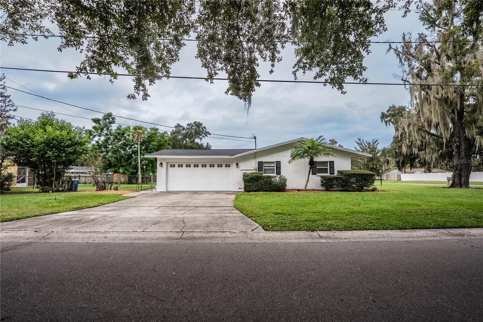 Side facing De La Palma - 975 E MANN RD, BARTOW