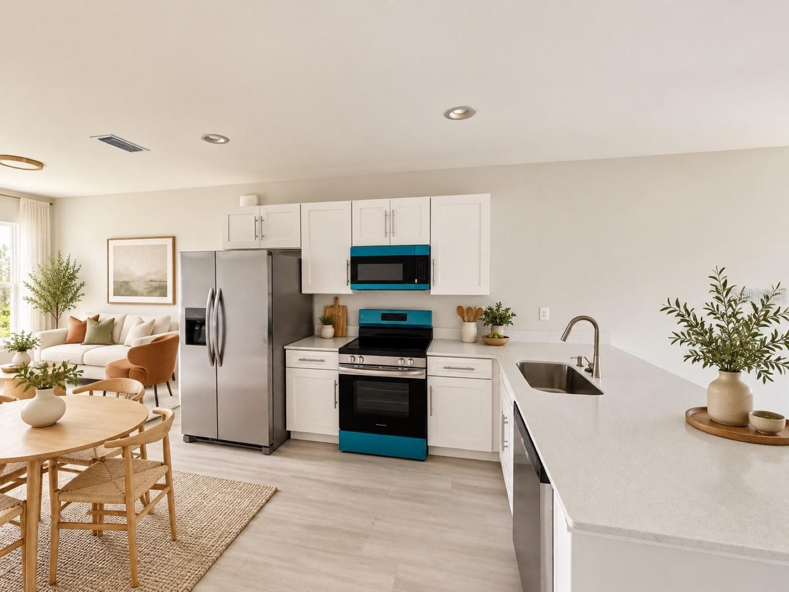 Virtually staged kitchen and dining area; furniture and decor are digitally added. - 612 BLUEBILL CT, POINCIANA