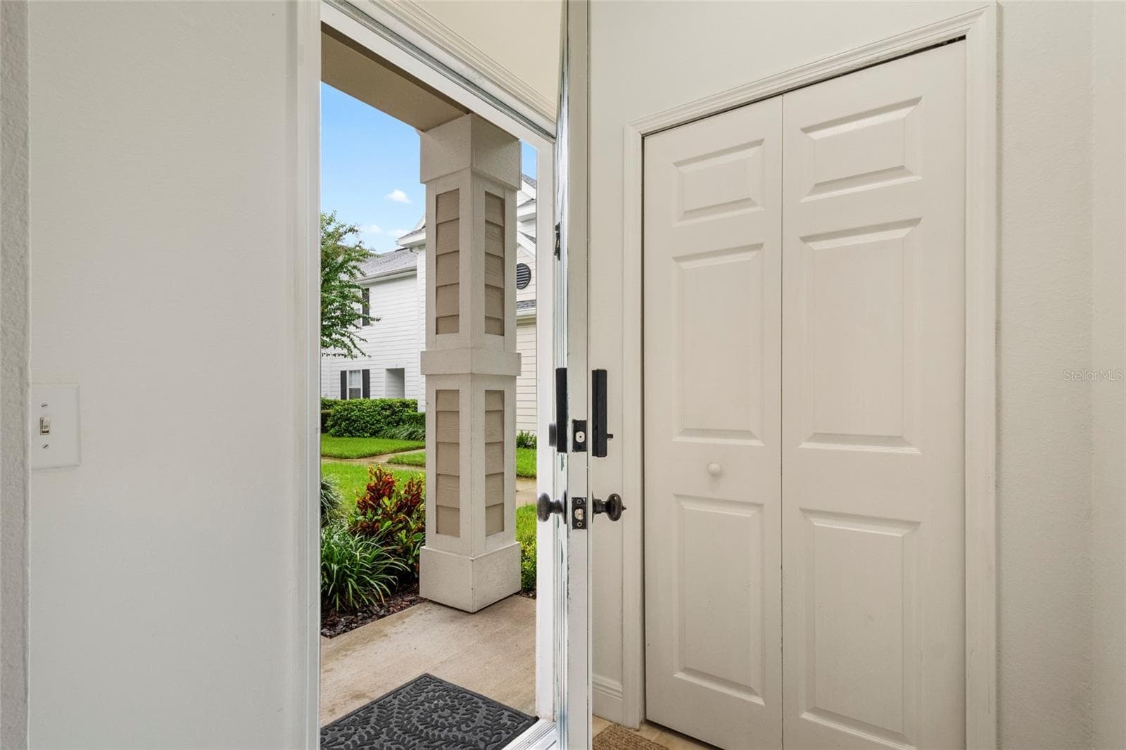 In the foyer as you enter you are welcomed by a generous landing and coat closet so your coats, umbrellas, shoes etc. can stay in the entry way. - 1300 EASTERN PECAN PL #208, WINTER GARDEN