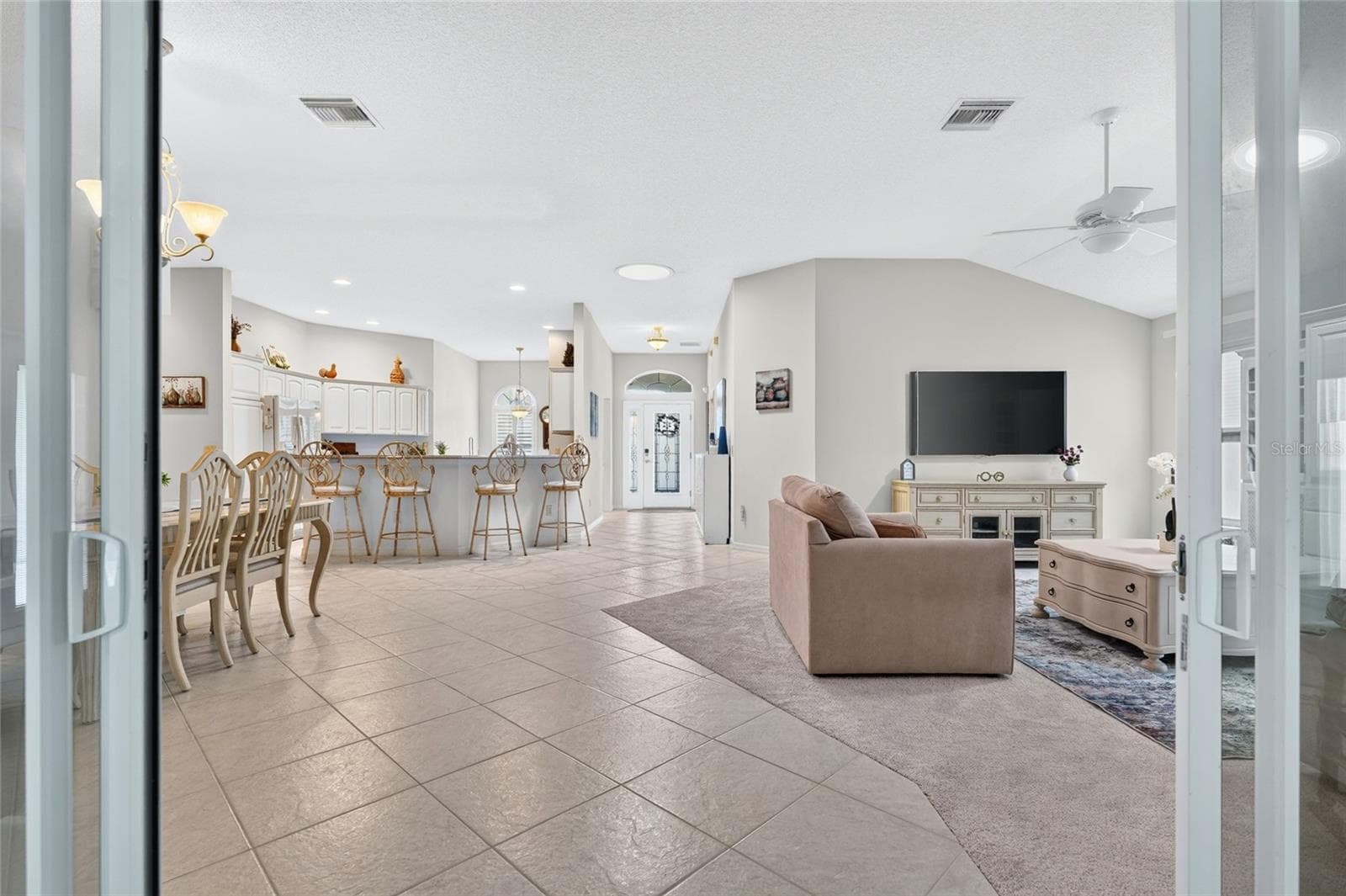 ENCLOSED LANAI INTO THE LIVING ROOM - 9245 SE 169TH BENTLEY ST, THE VILLAGES