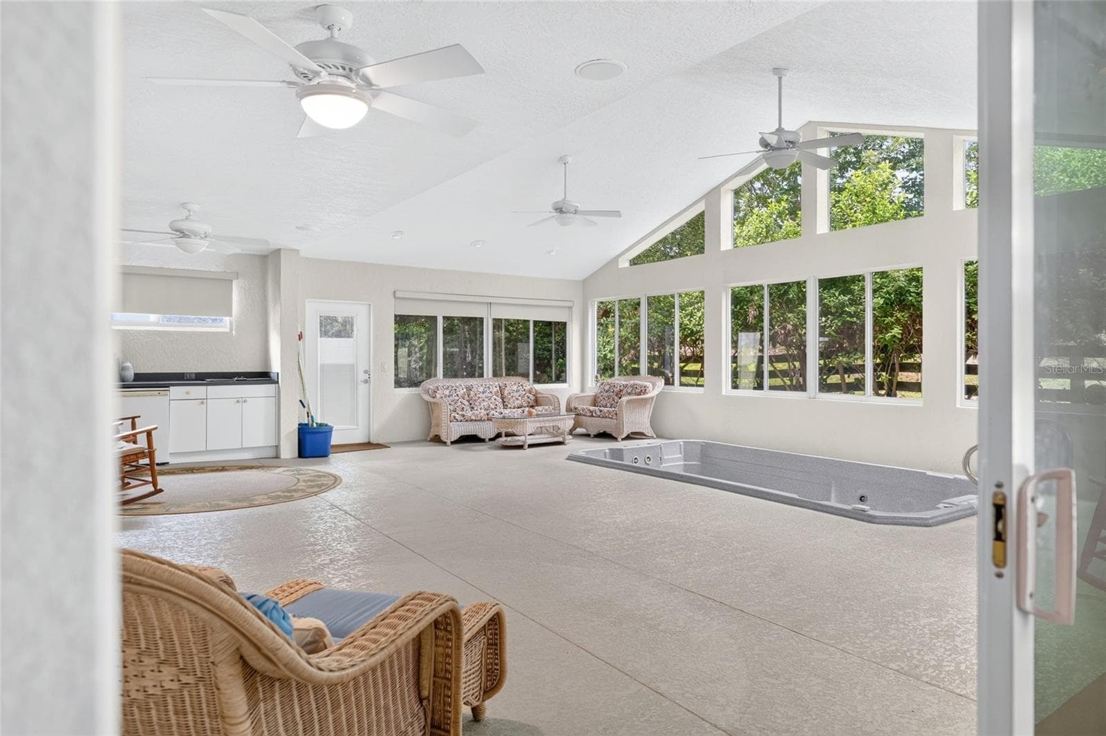 PRIMARY BEDROOM TO THE ENCLOSED LANAI - 9245 SE 169TH BENTLEY ST, THE VILLAGES