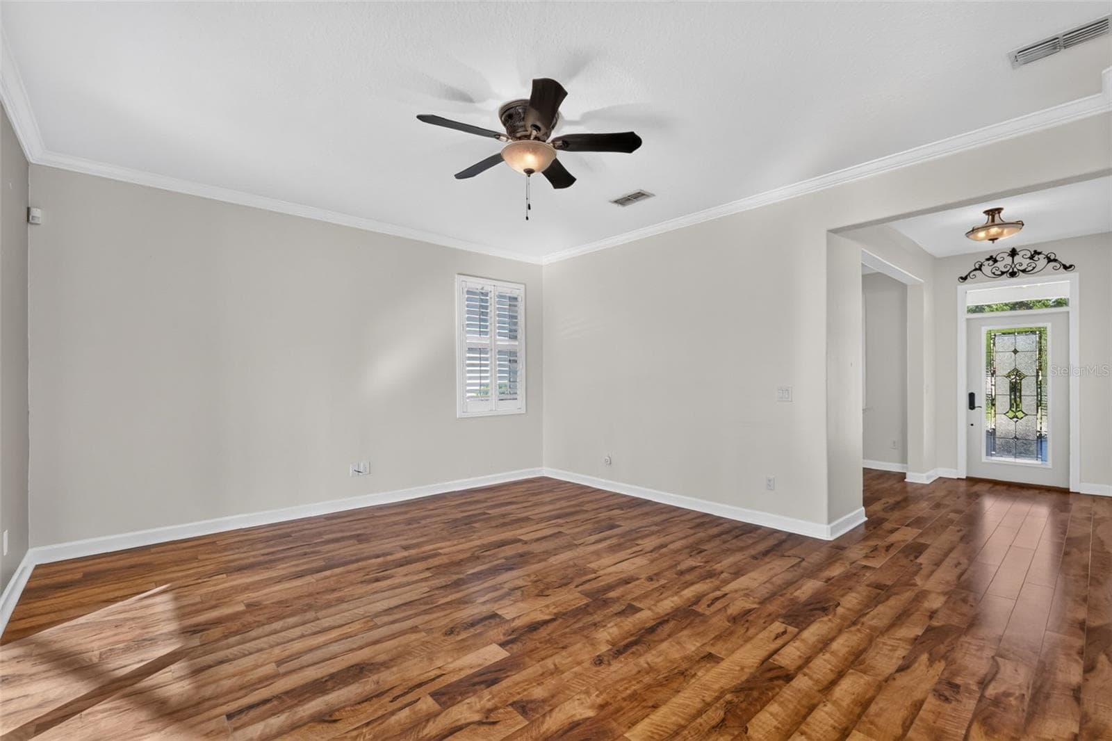 Easy care laminate floors, plantation shutters and crown molding elevate this home ~ - 4913 ROYCE DR, MOUNT DORA