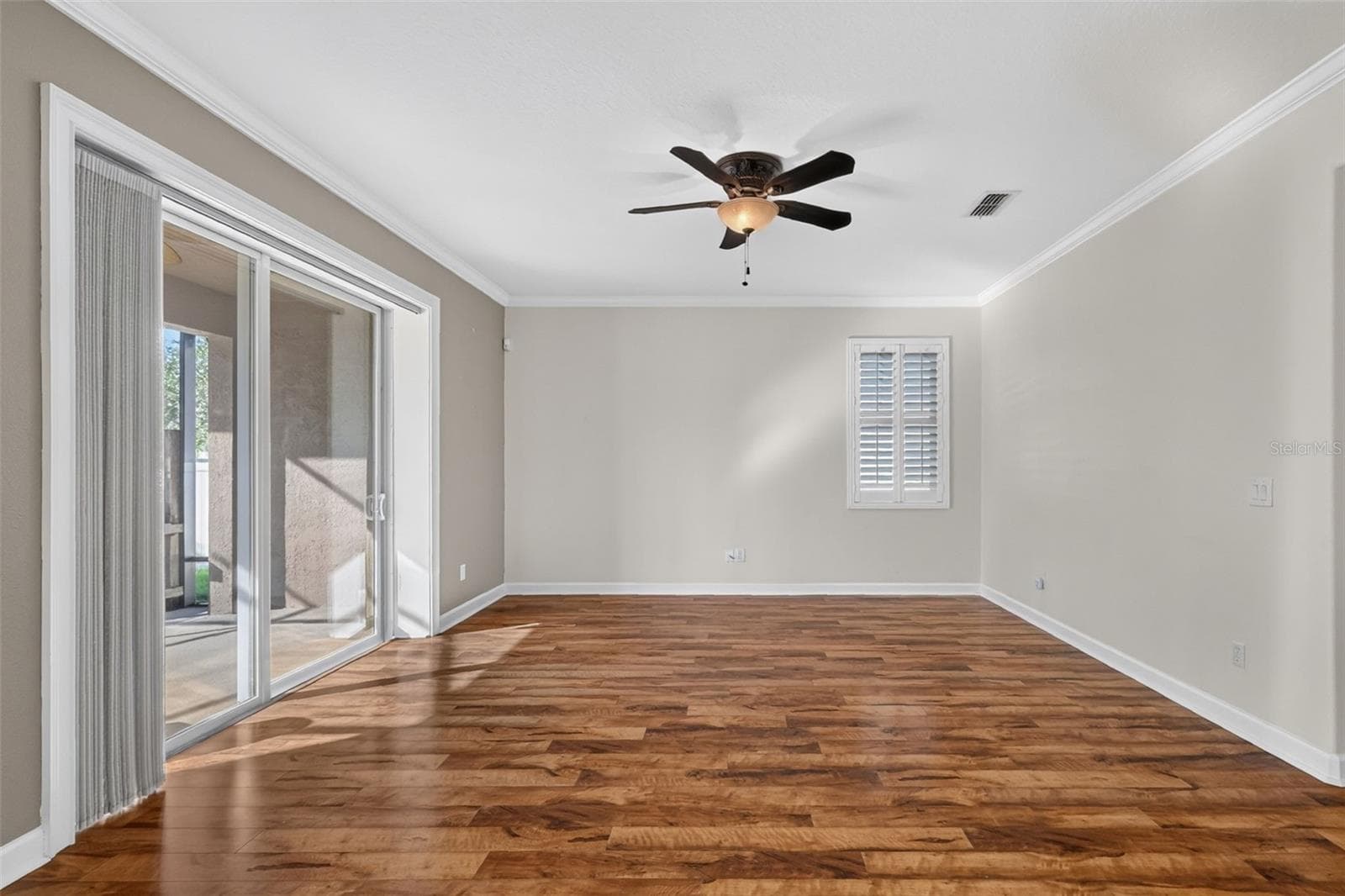 Pleated shades glide across the pocket sliding doors ~ - 4913 ROYCE DR, MOUNT DORA
