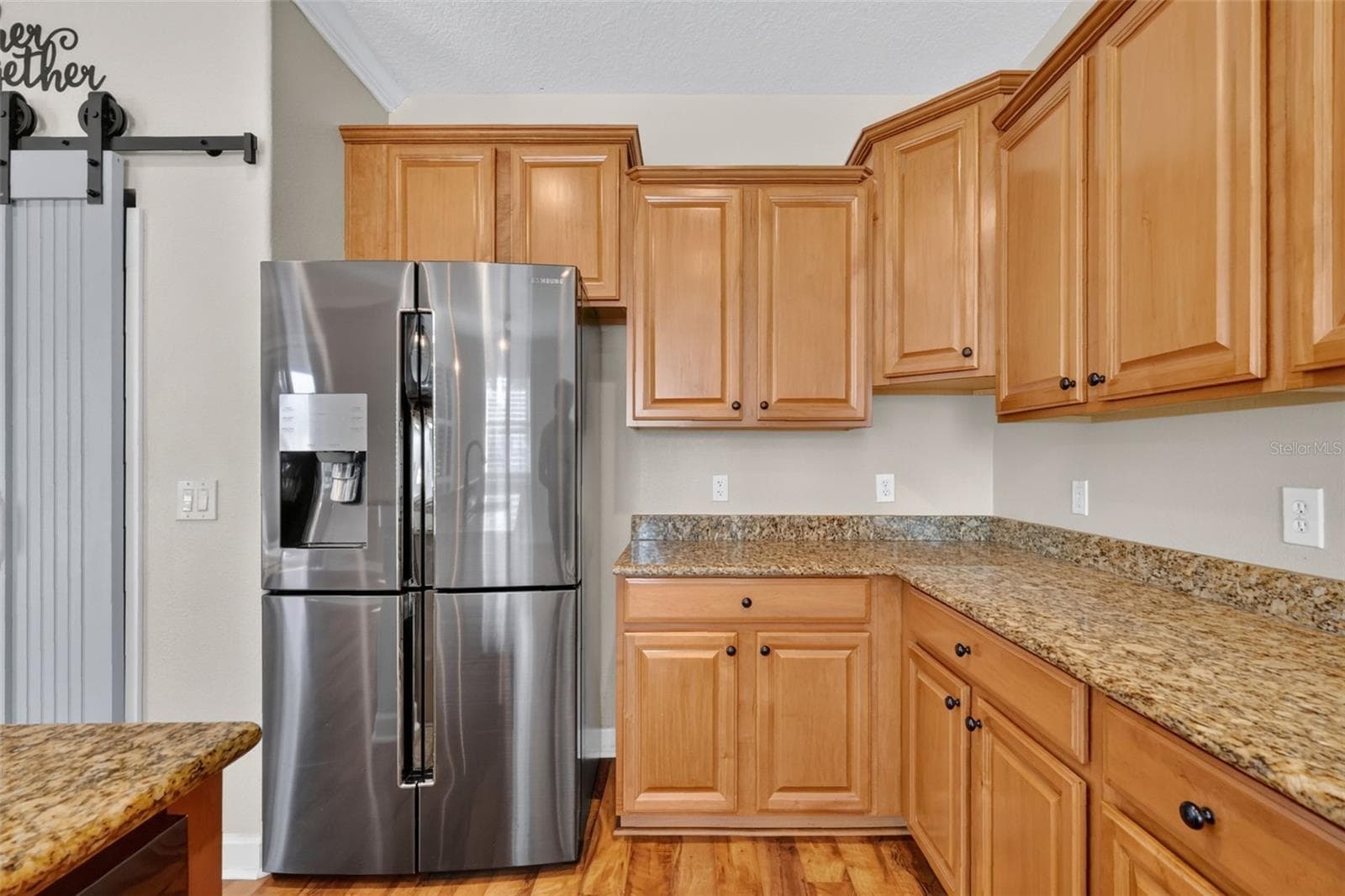 This 4 door refrigerator can be set with one or two freezer compartments, you decide! - 4913 ROYCE DR, MOUNT DORA