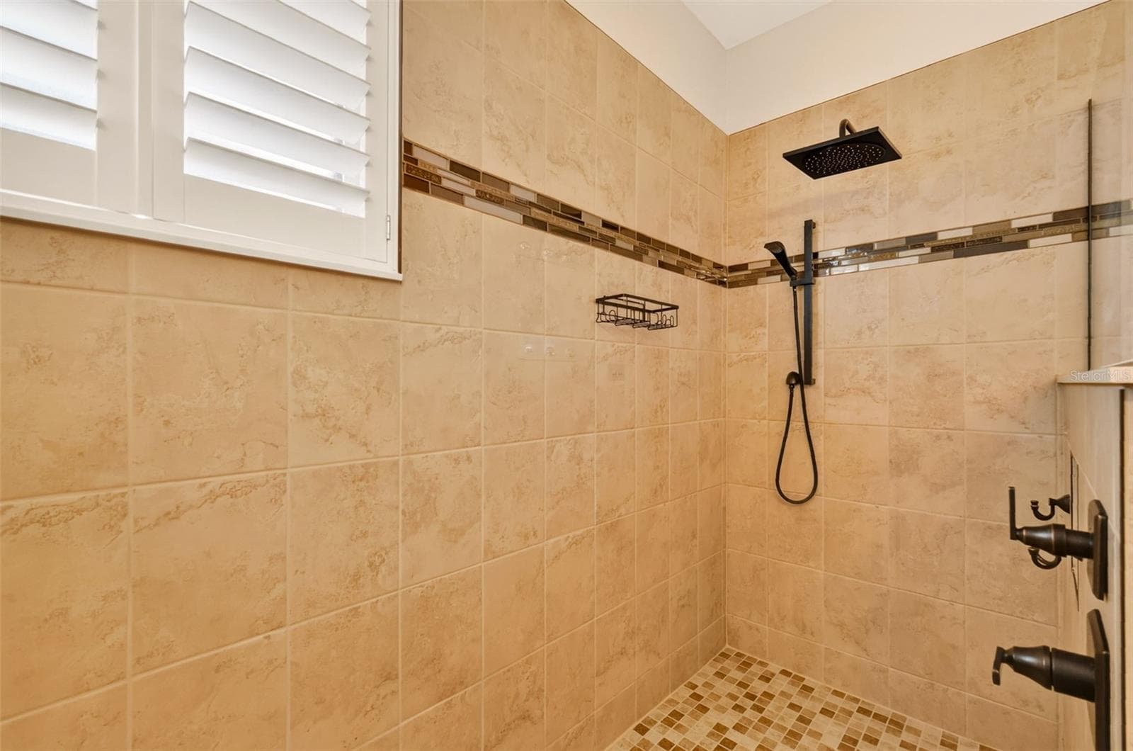 Hand spray and rain shower head, and a built-in niche keeps a clean look in your shower ~ - 4913 ROYCE DR, MOUNT DORA