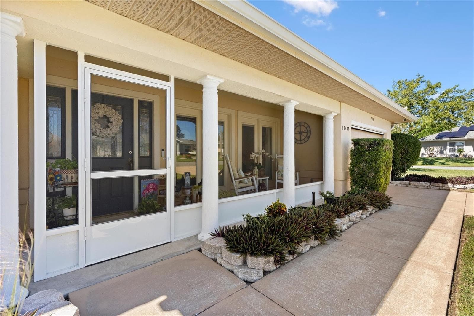 Screened front porch. - 17432 SE 112TH CT, SUMMERFIELD