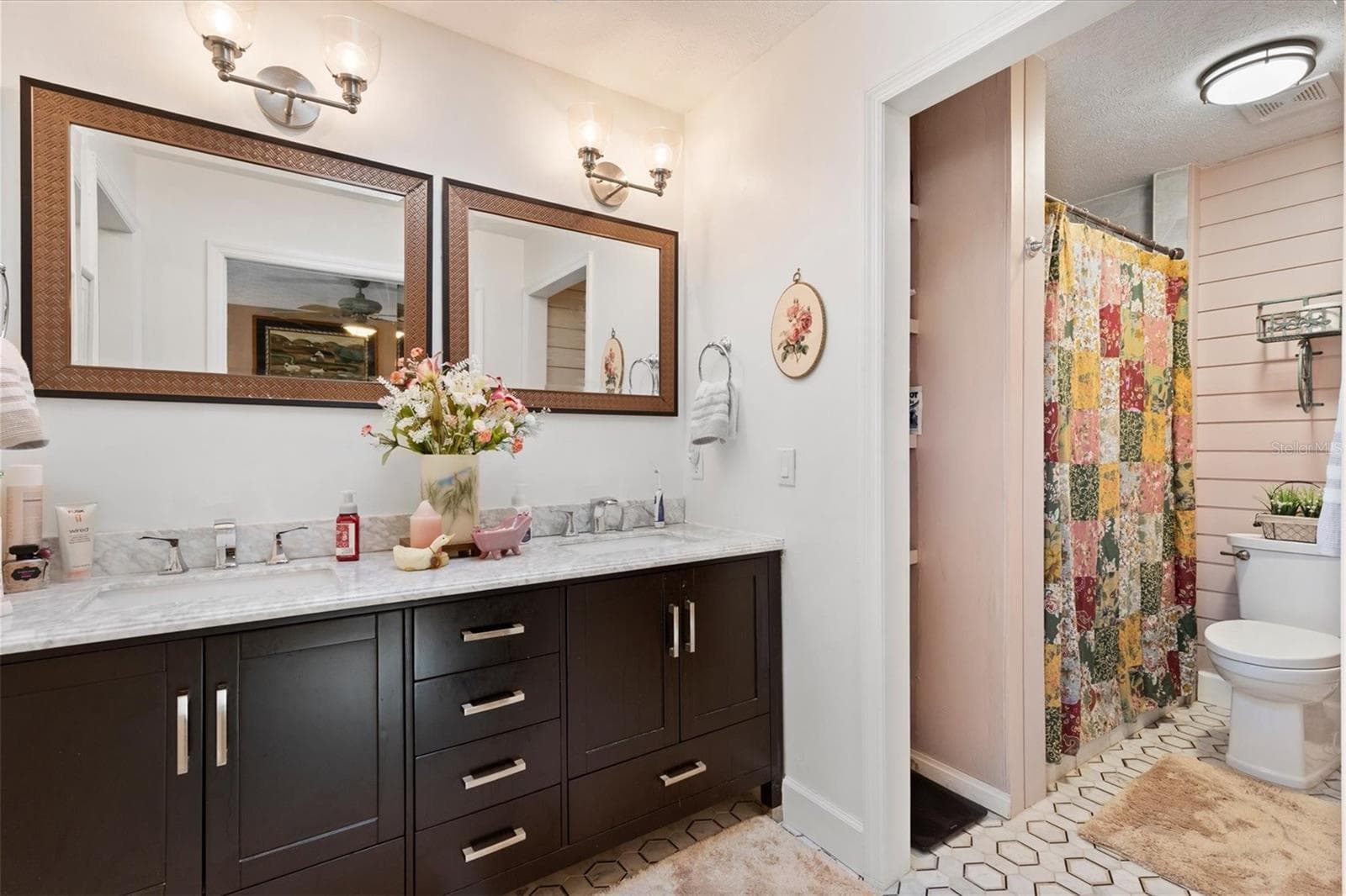 En-suite bathroom with Dual sink vanity, separate walk-in shower, large walk-in closet. - 17432 SE 112TH CT, SUMMERFIELD