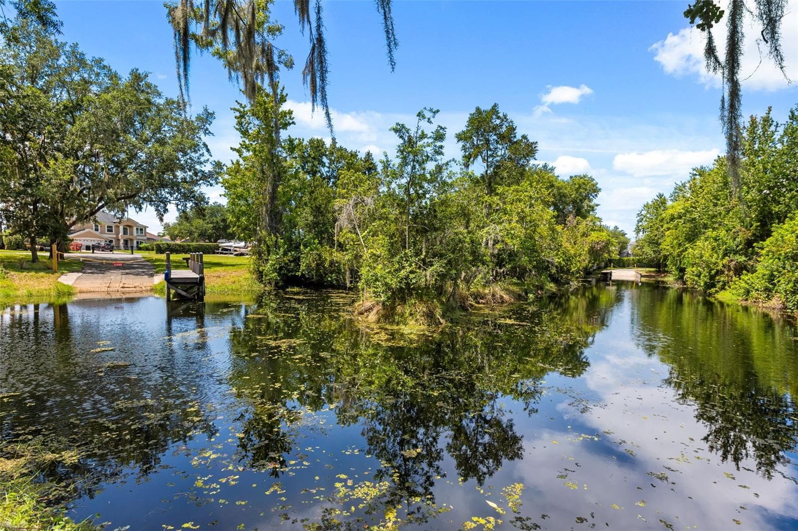 A private dock and boatlift provide access to Lake Sheen and the entire Butler Chain, while a gated community boat ramp is approximately 300 feet away. - 10430 LAKE COTTAGE LN, ORLANDO