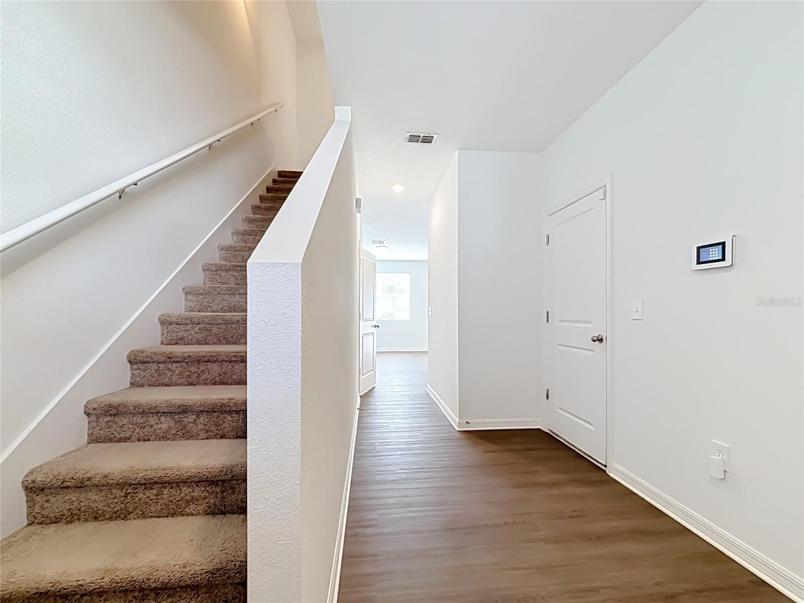 Stairs to go up and garage access to the right - 811 GRANDIN ST, DAVENPORT