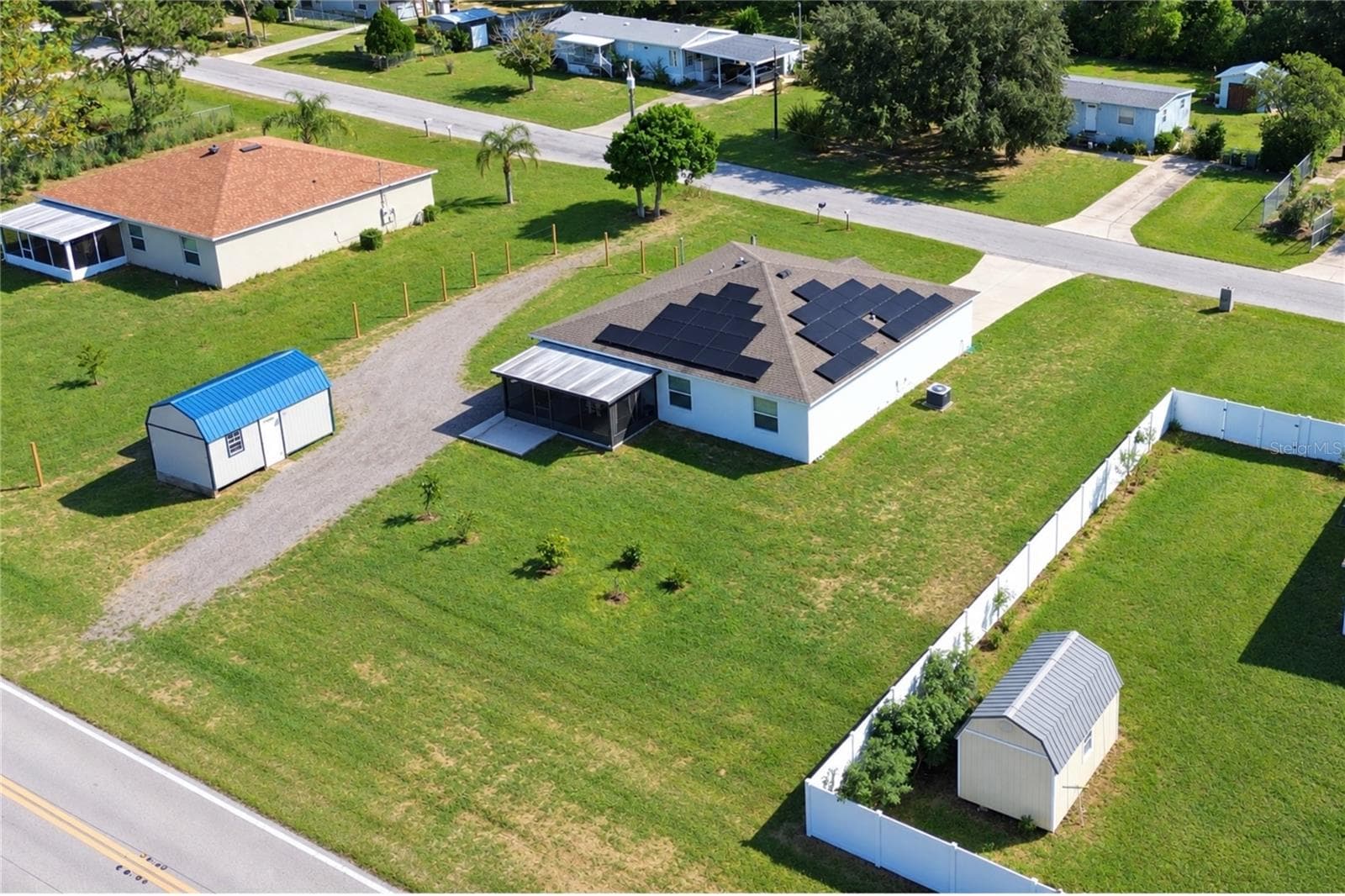 Aerial view of the property and its surroundings from another angle. - 14 ROELS ST, HAINES CITY